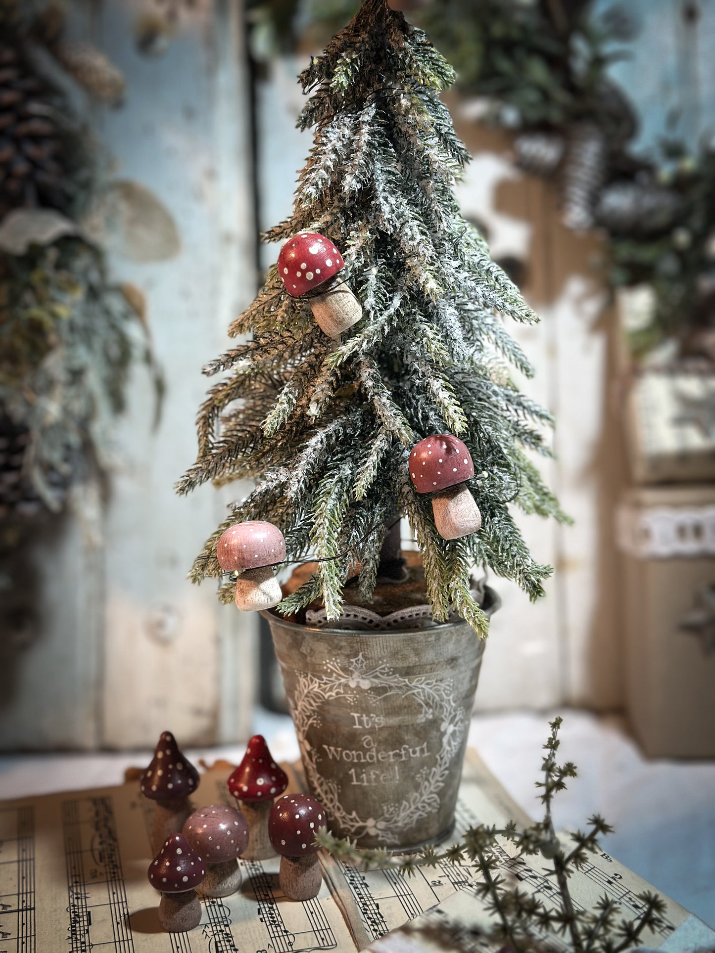 A wooden hand painted and trimmed Christmas village toadstool