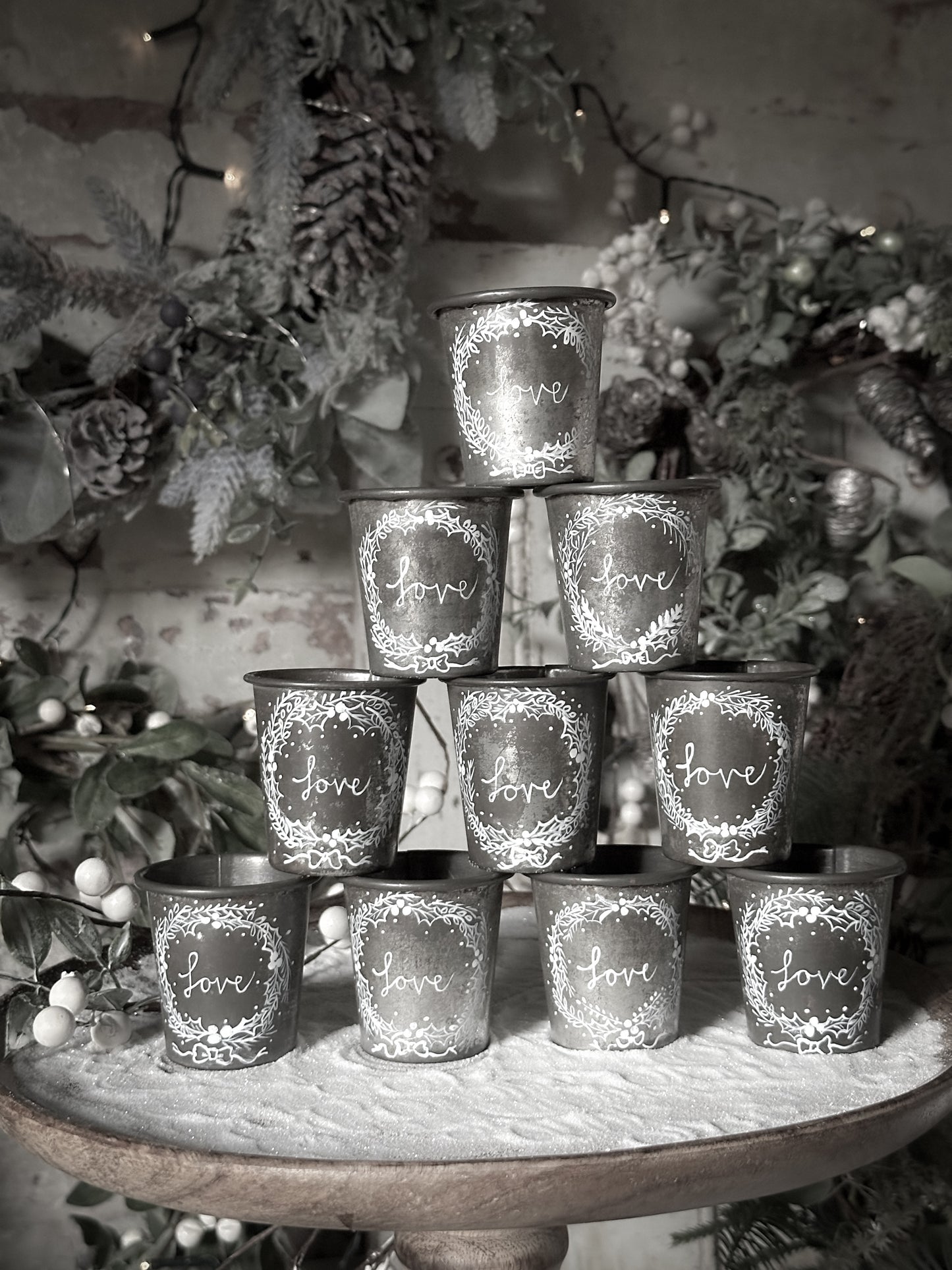 A pretty hand painted Dariole tin tea light holder