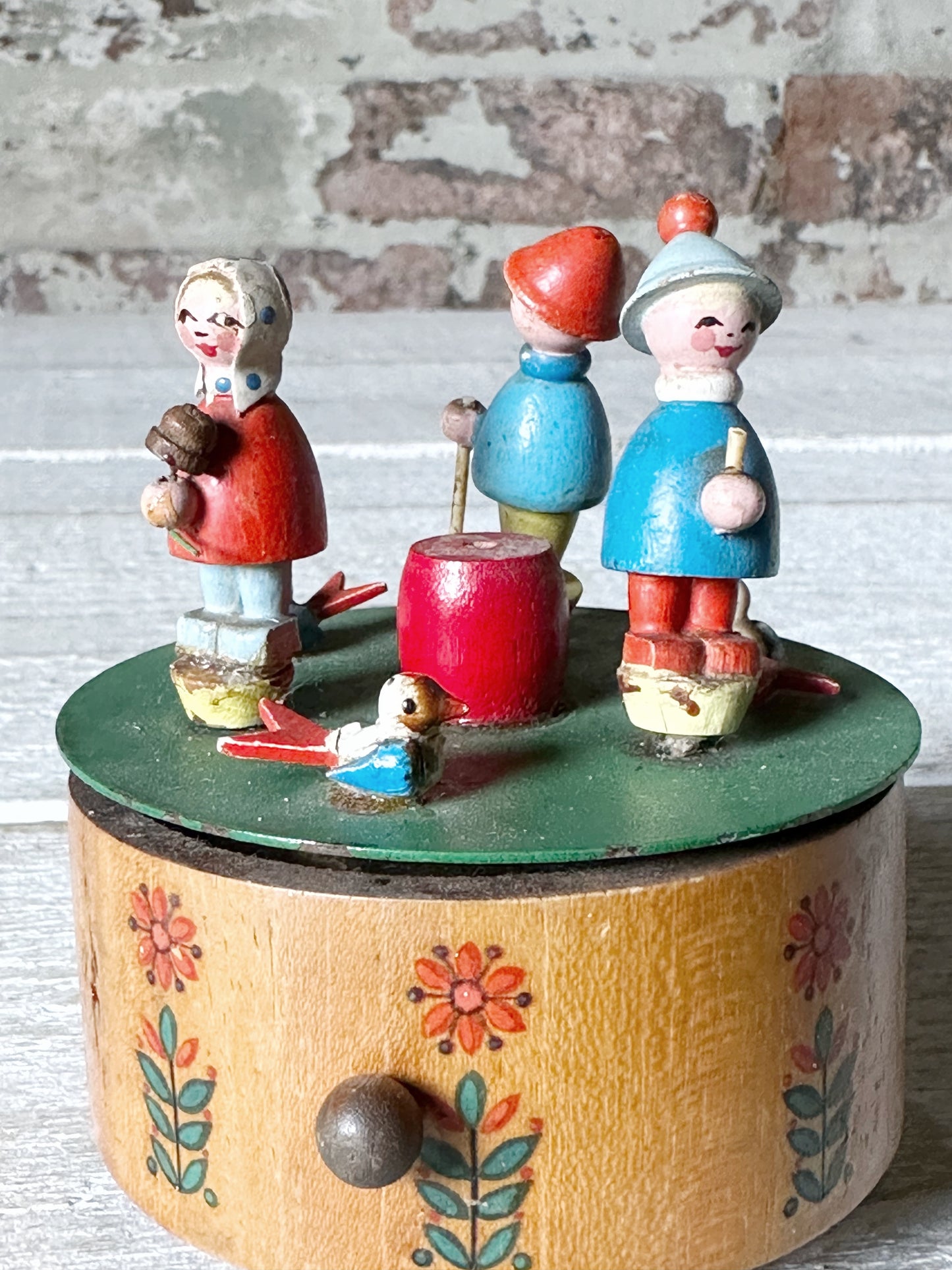 A vintage German Erzgebirge wooden Folkart musical merry-go-round