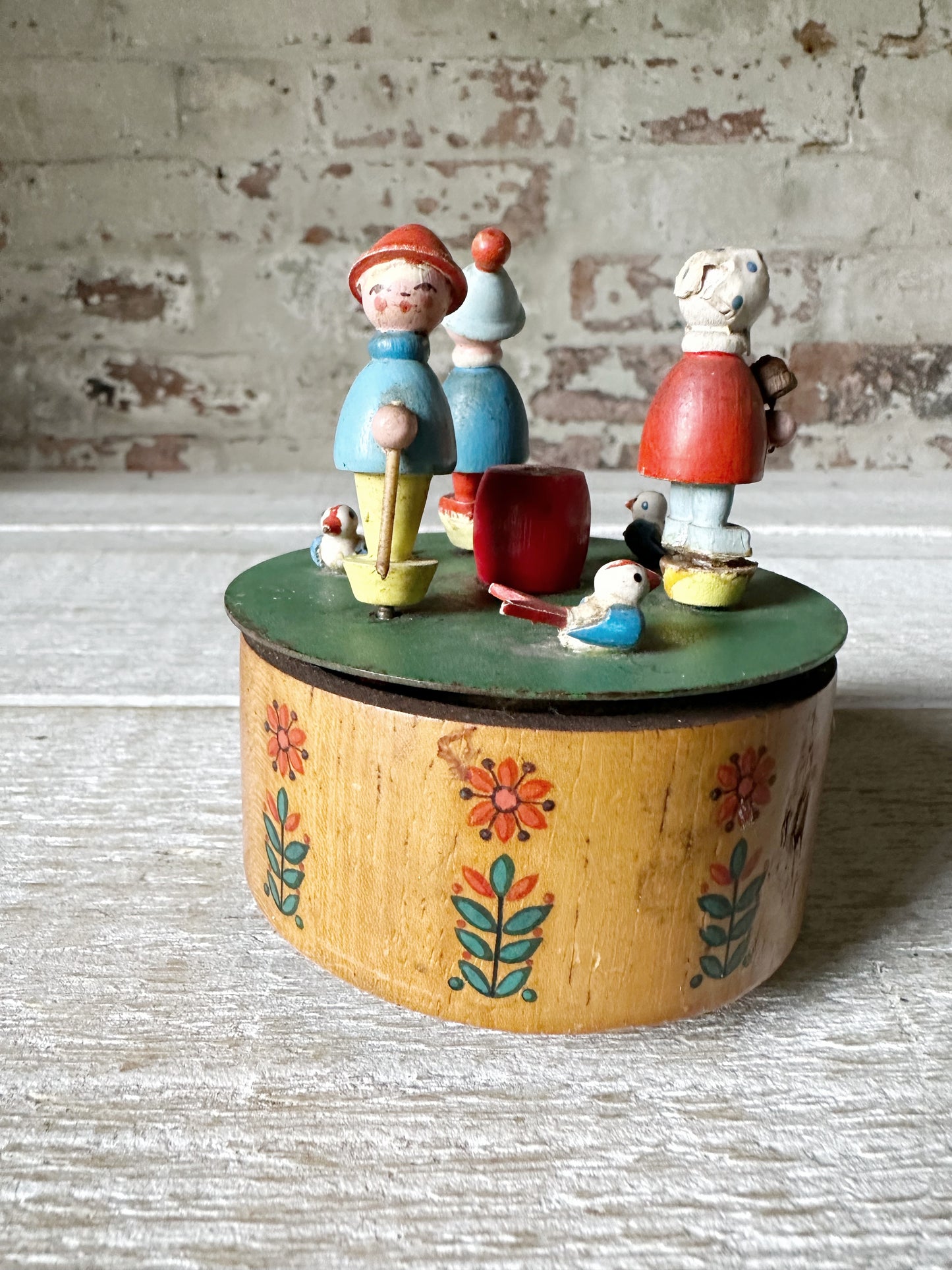 A vintage German Erzgebirge wooden Folkart musical merry-go-round