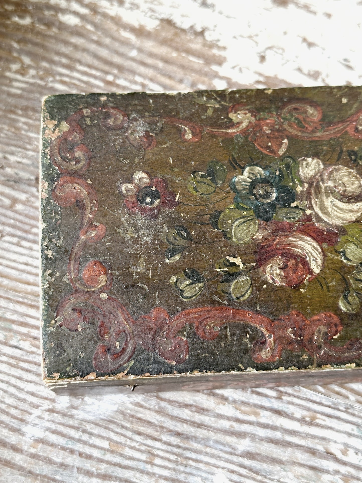 A beautiful antique painted box with floral detail