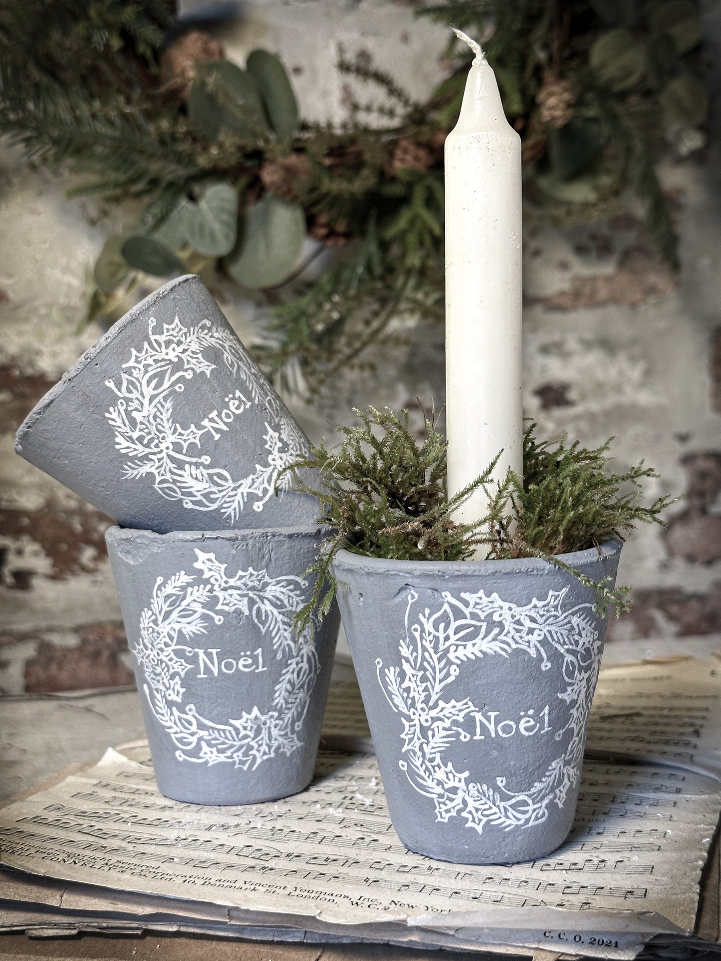 A small illustrated Victorian Christmas terracotta pot