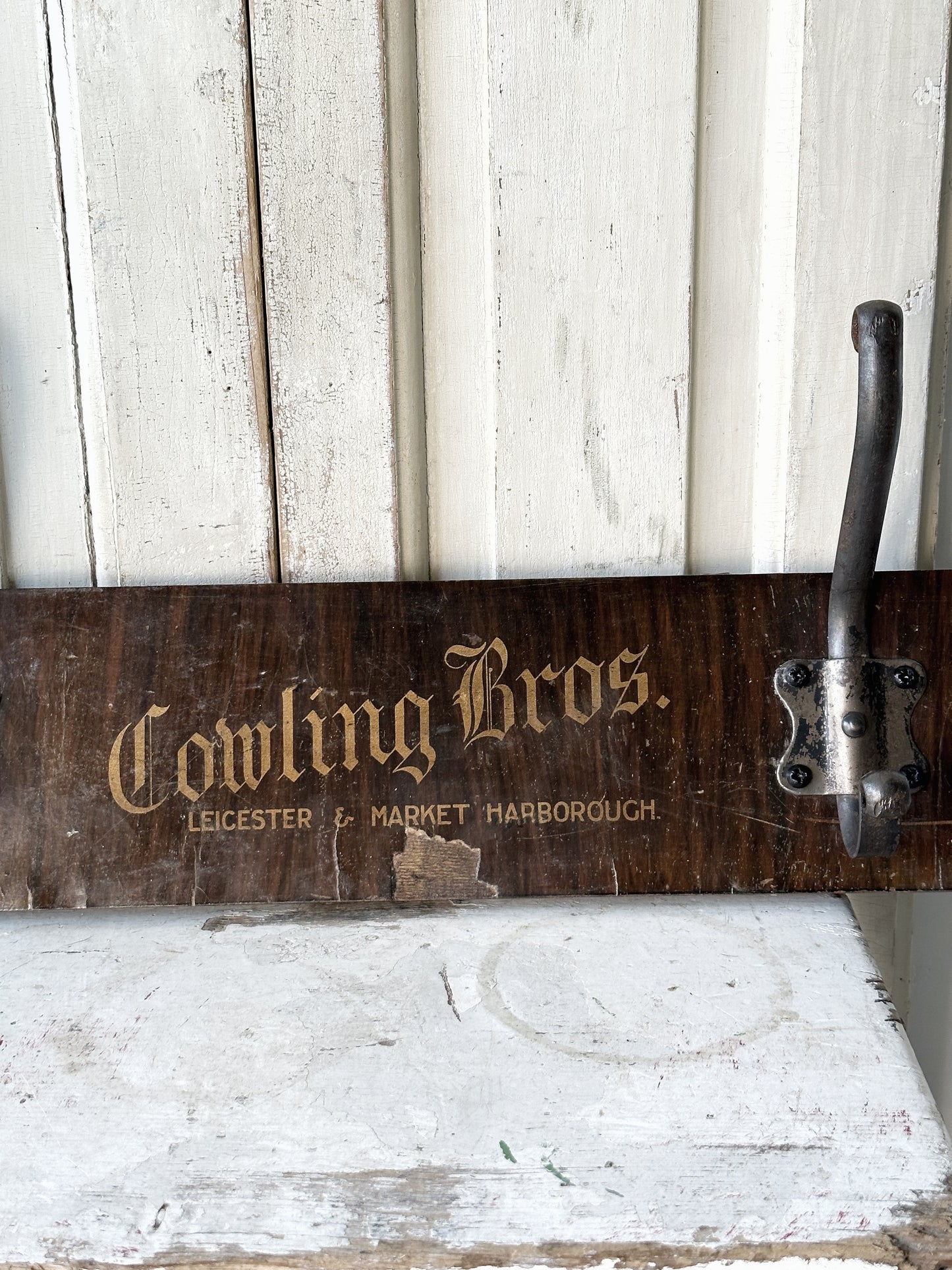 Salvaged sign written drawer front coat pegs