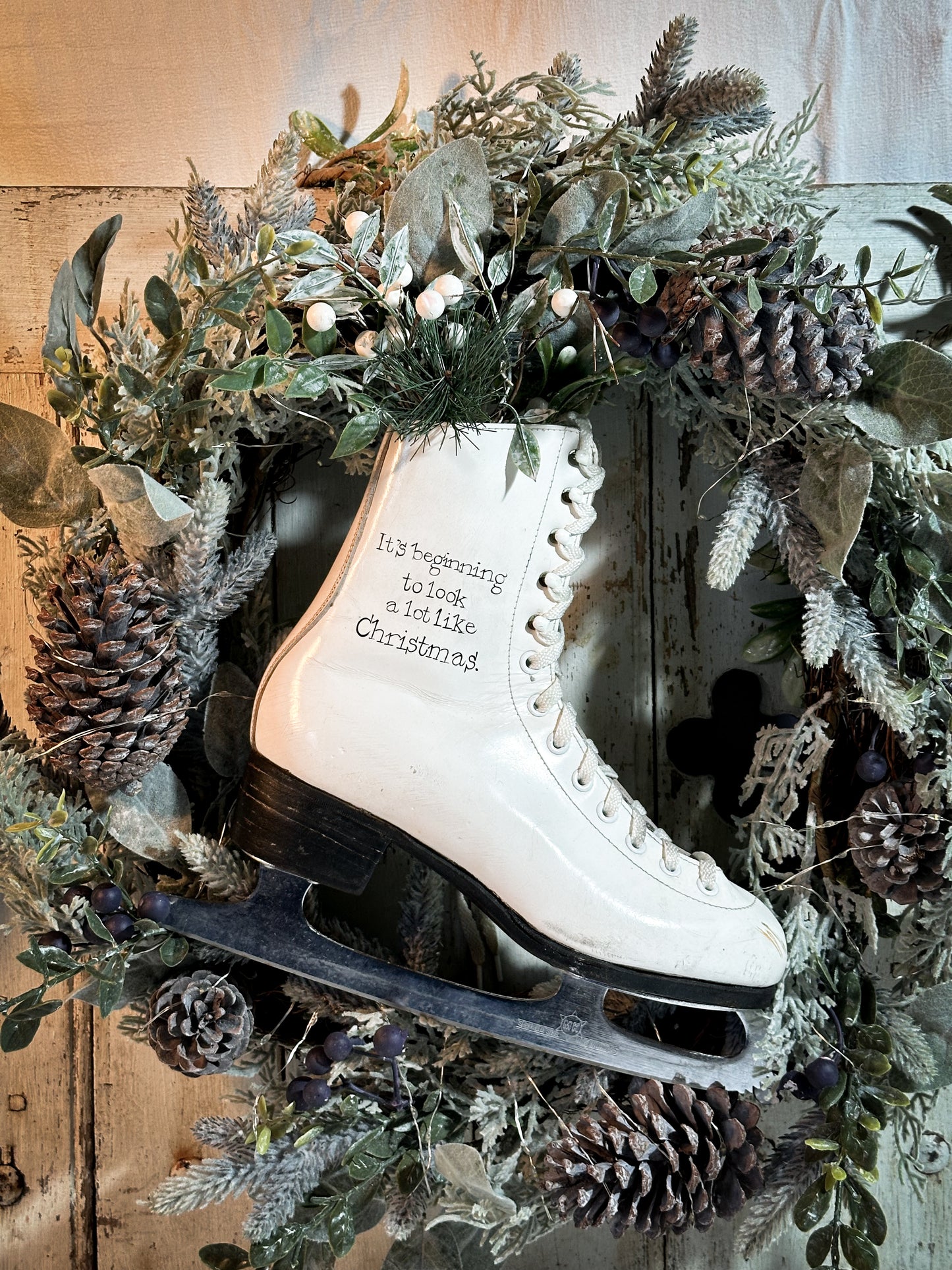 A beautiful vintage Christmas ice skate hand painted using traditional sign writer’s techniques and materials