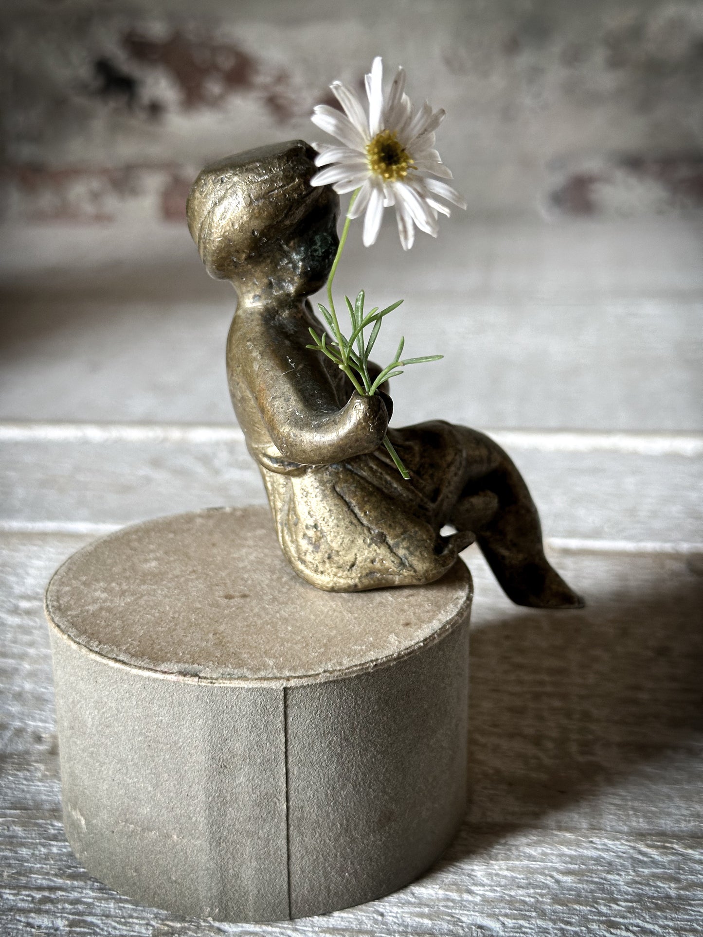 A Delightful Antique Bronze Decorative Seated Cherub