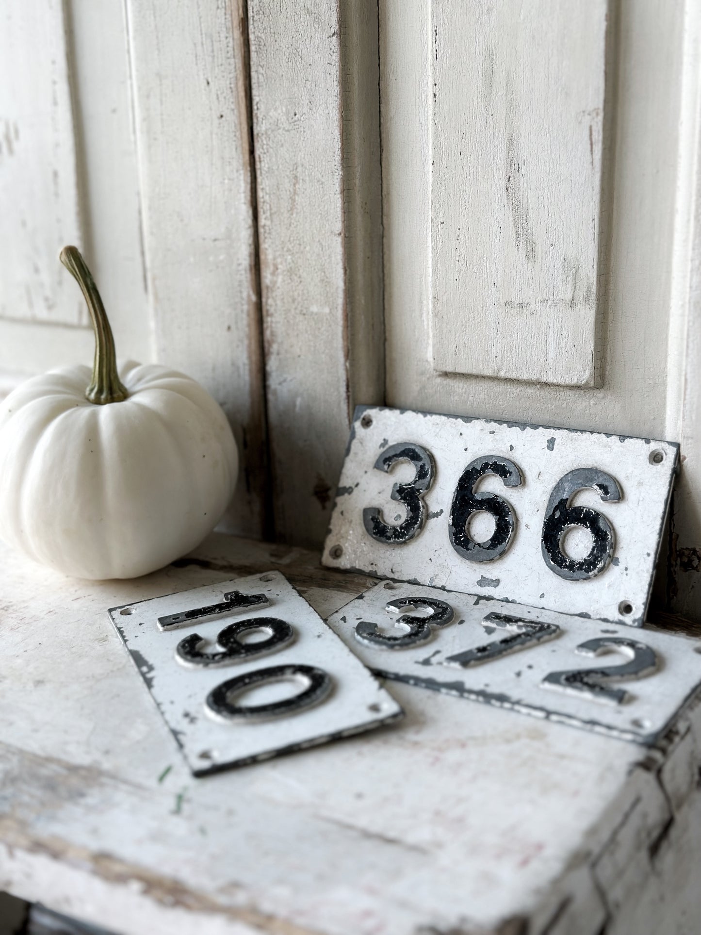 Three vintage French cast iron signs locker numbers