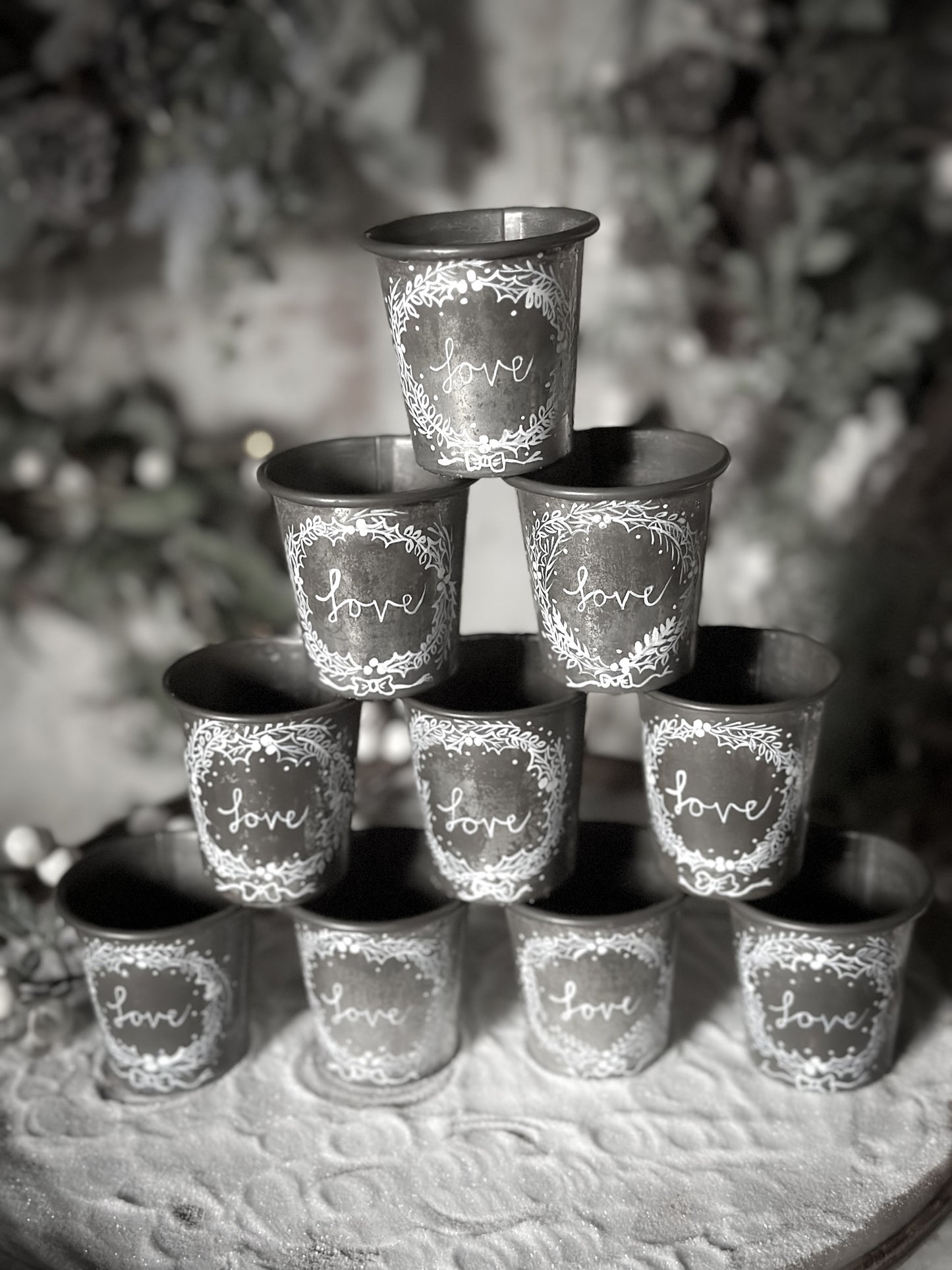 A pretty hand painted Dariole tin tea light holder