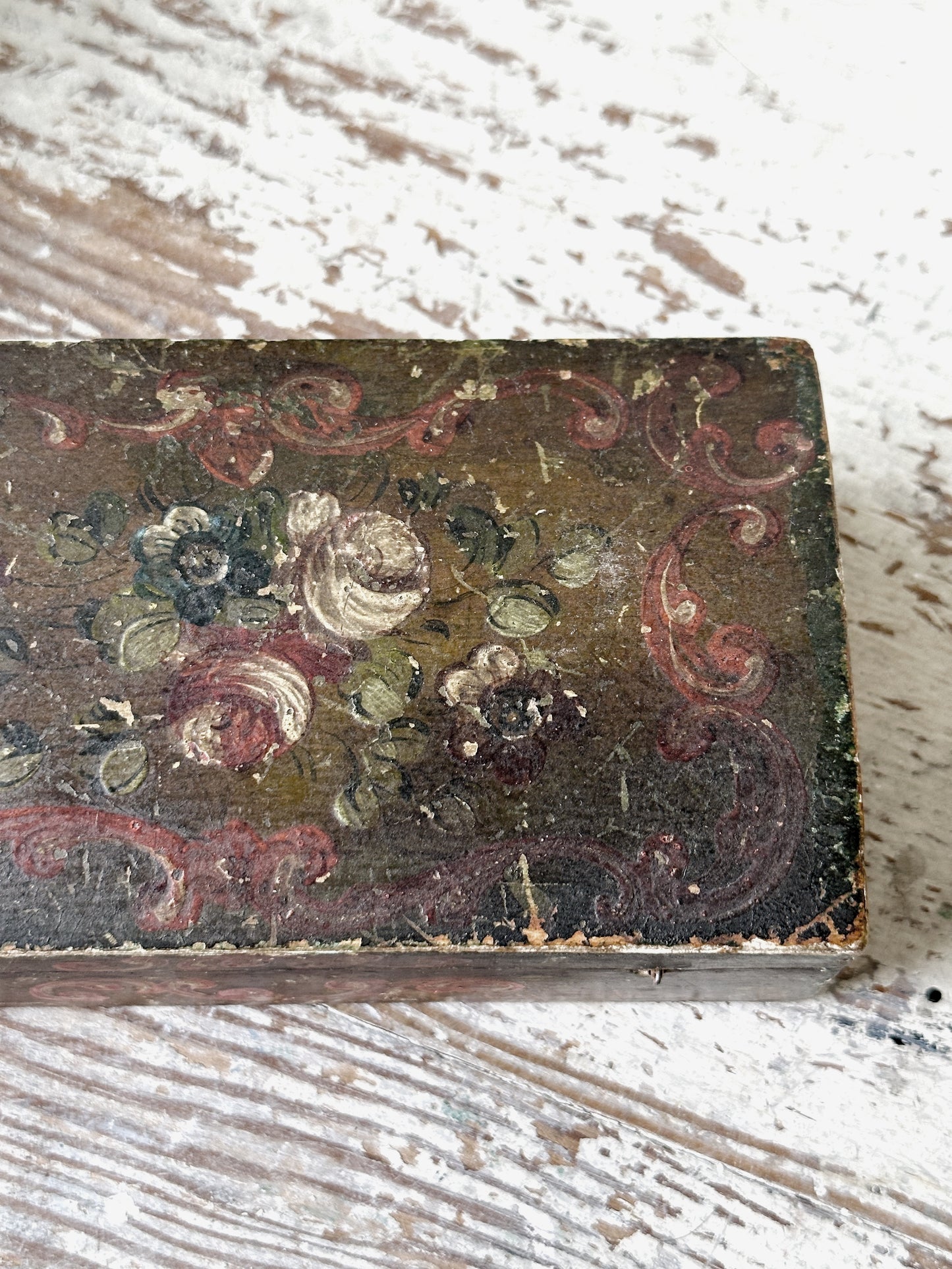 A beautiful antique painted box with floral detail