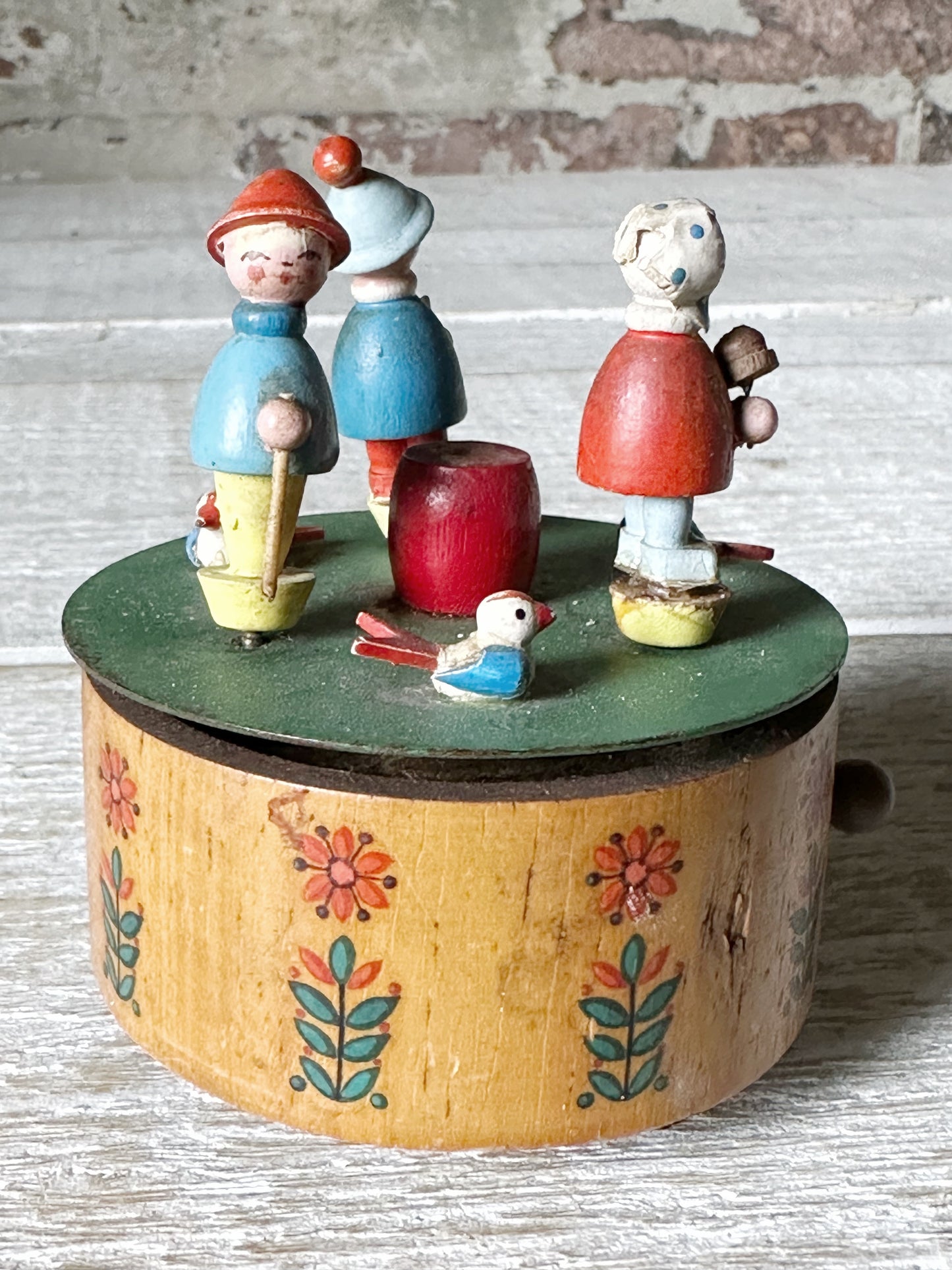 A vintage German Erzgebirge wooden Folkart musical merry-go-round