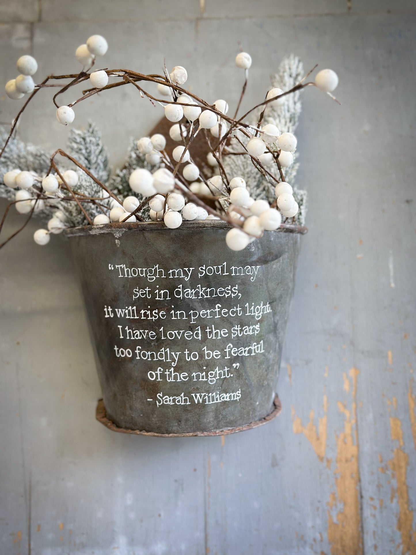 A Recycled Metal Candle Store With A Hand Painted Quote