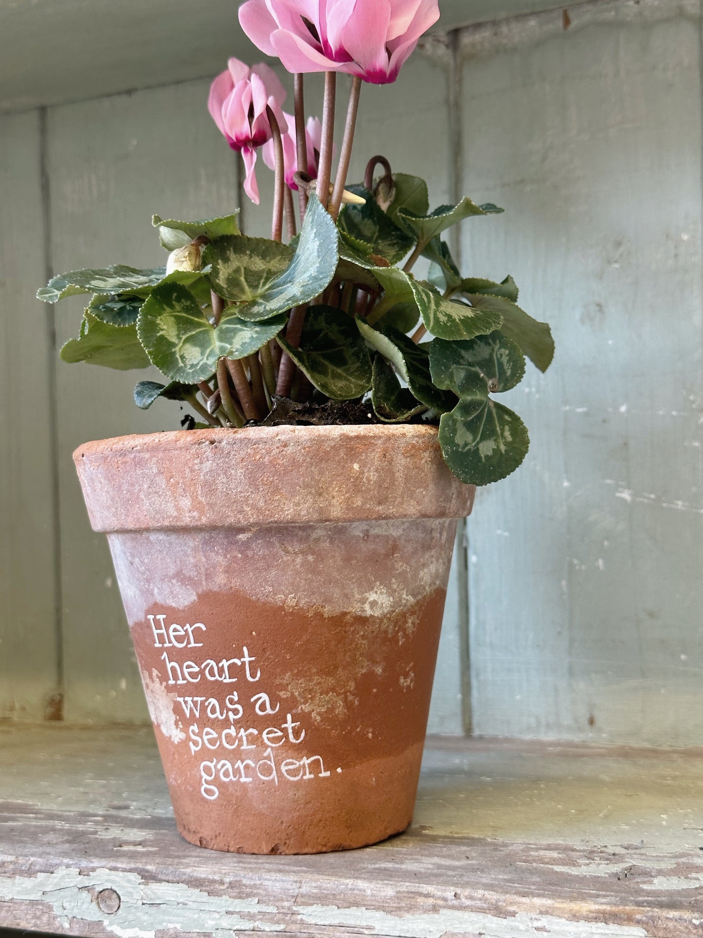 A Victorian terracotta pot with a quote