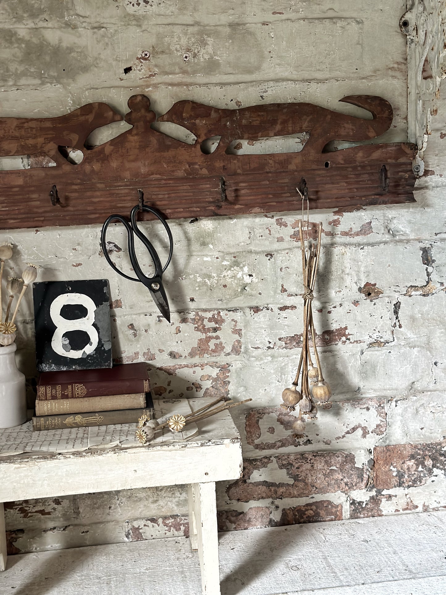 Antique primitive wooden game rack with stylised foxes