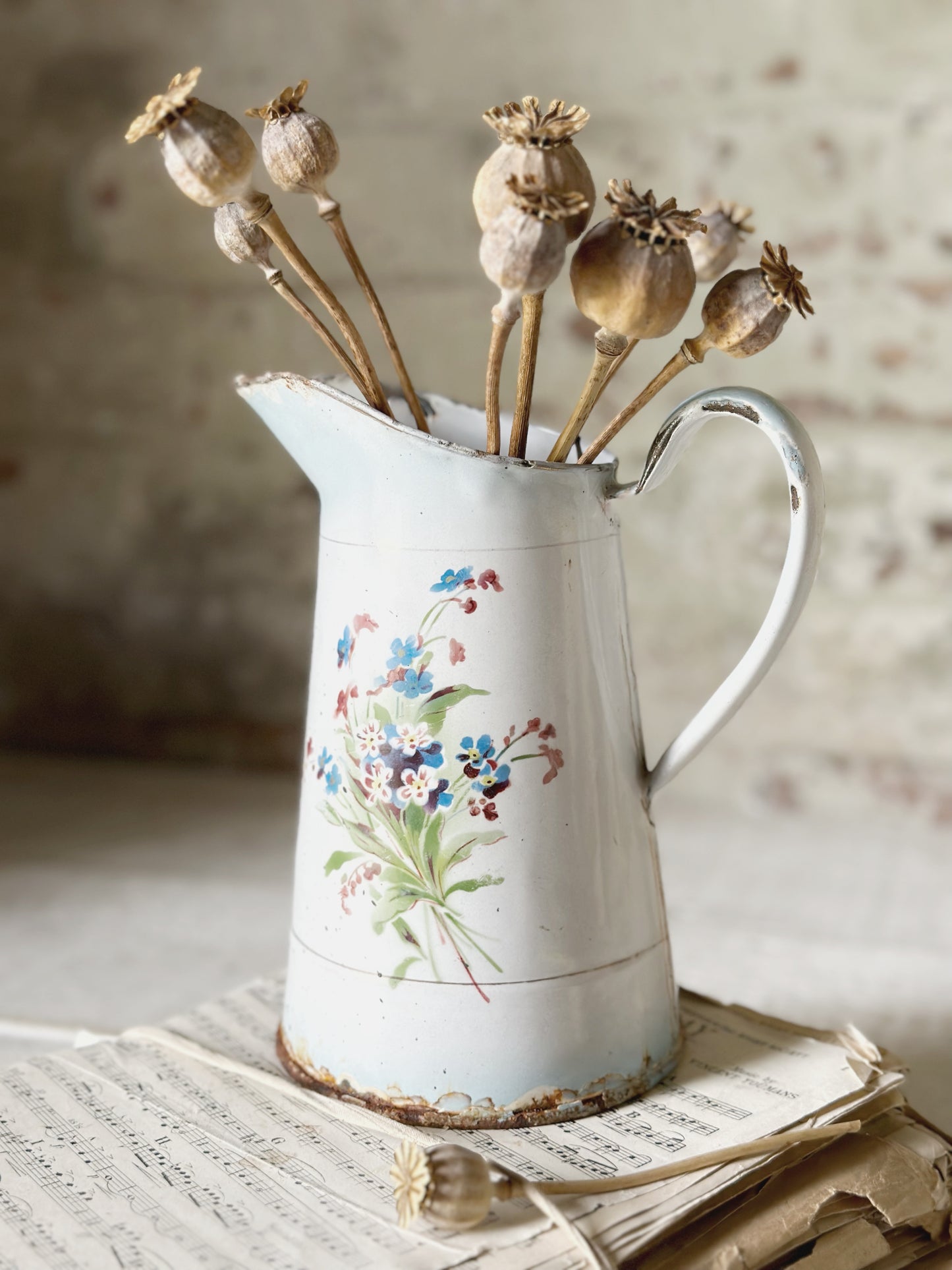 A beautiful French antique enamel jug with floral detail
