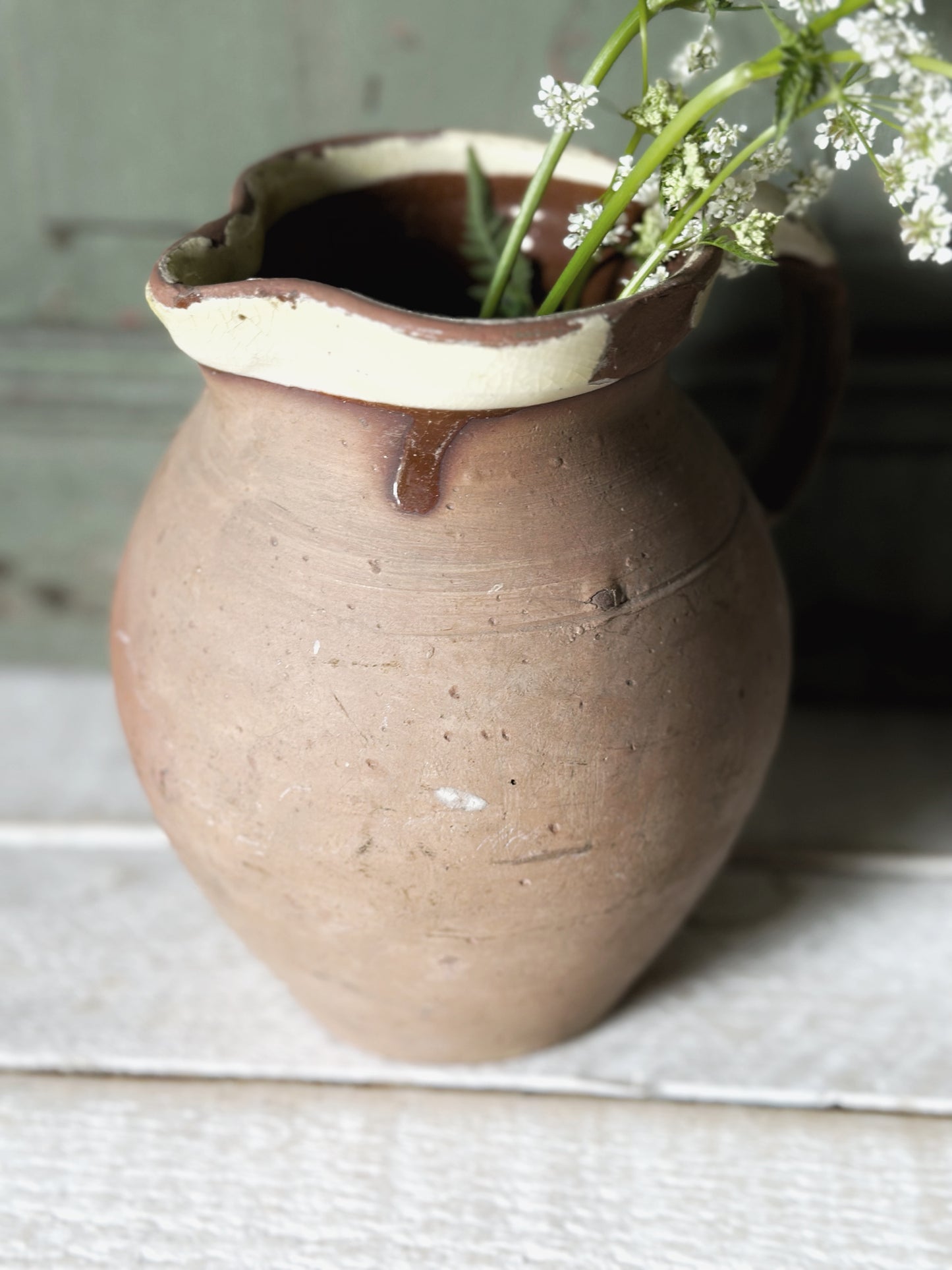 Antique pottery glazed dairy jug