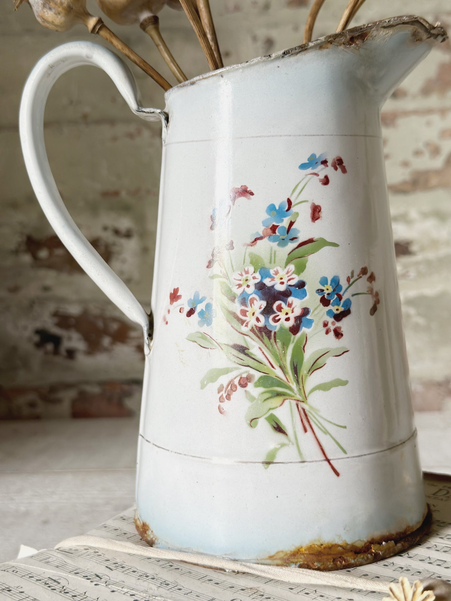 A beautiful French antique enamel jug with floral detail