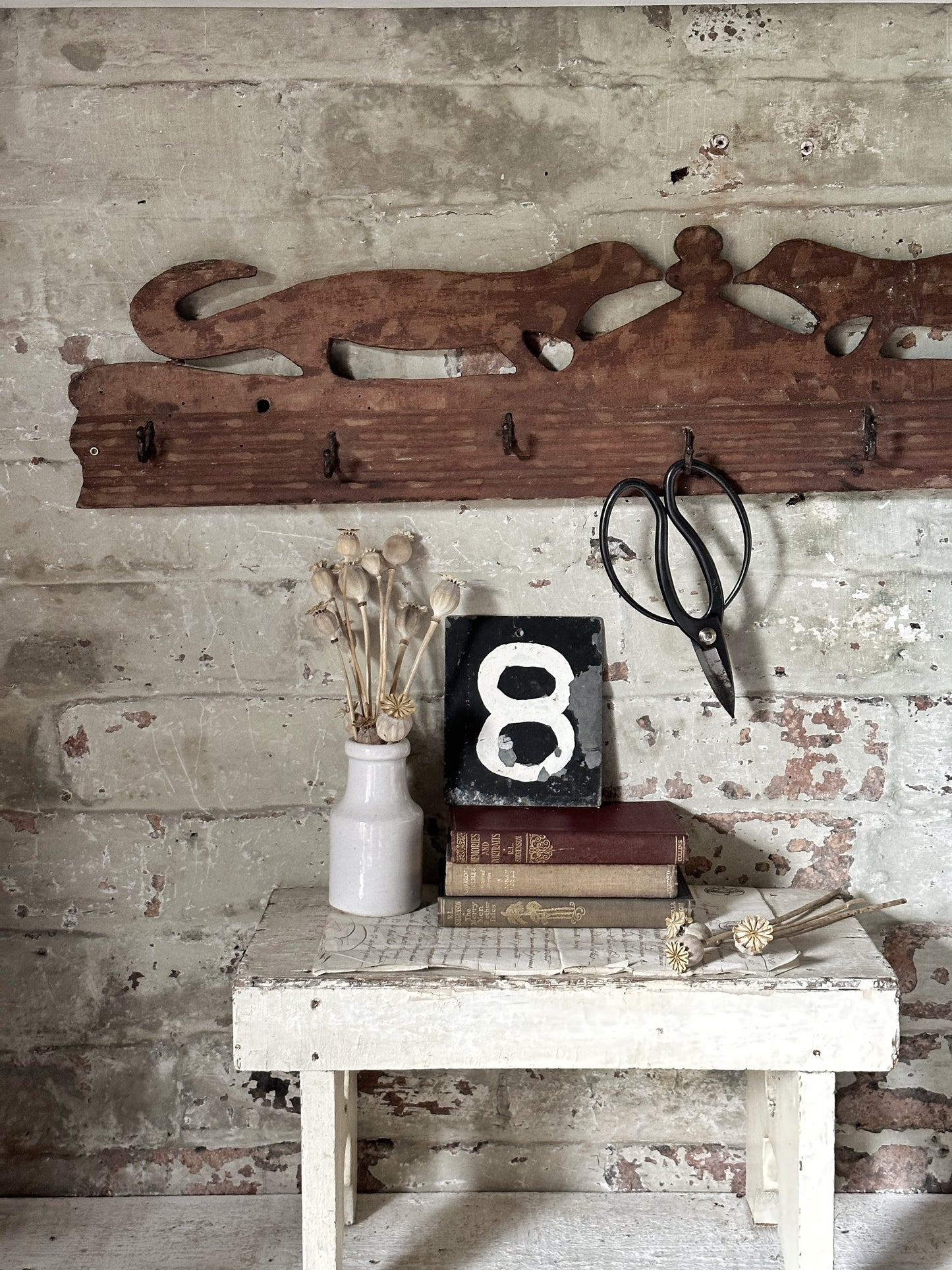 Antique primitive wooden game rack with stylised foxes
