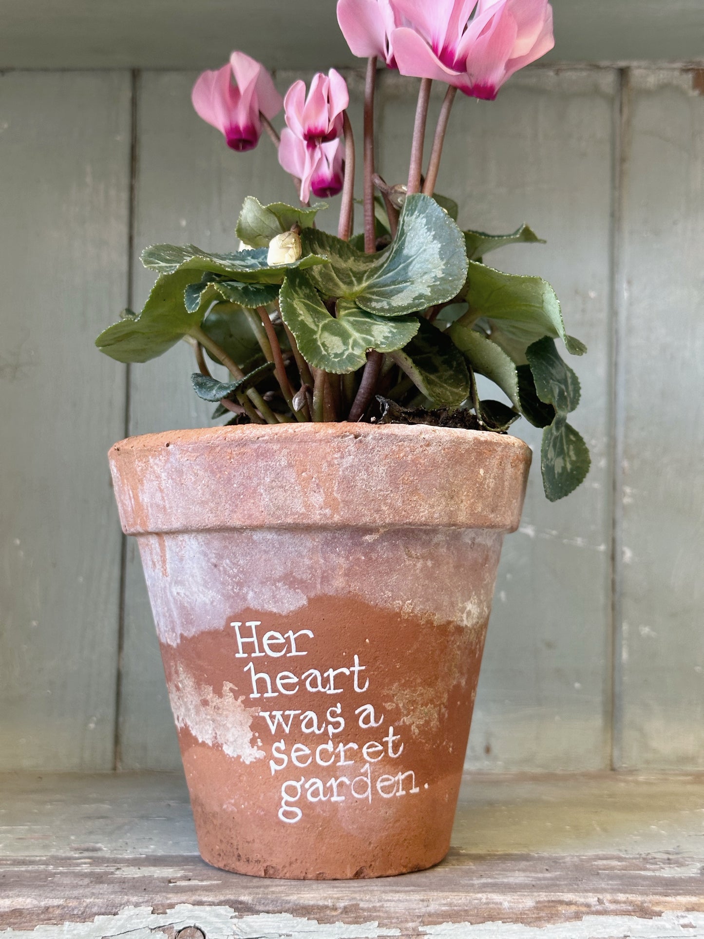 A Victorian terracotta pot with a quote