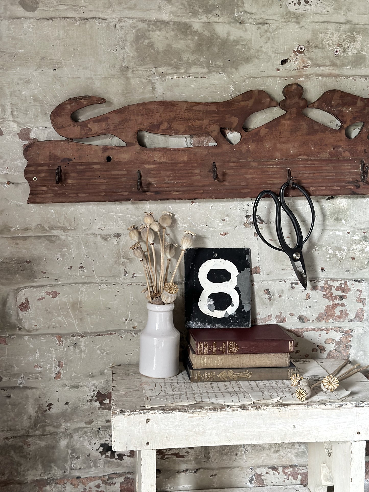 Antique primitive wooden game rack with stylised foxes