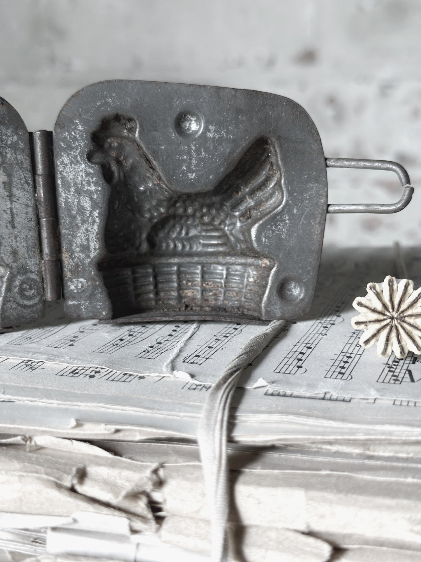 An Antique hinged chocolate mould hen