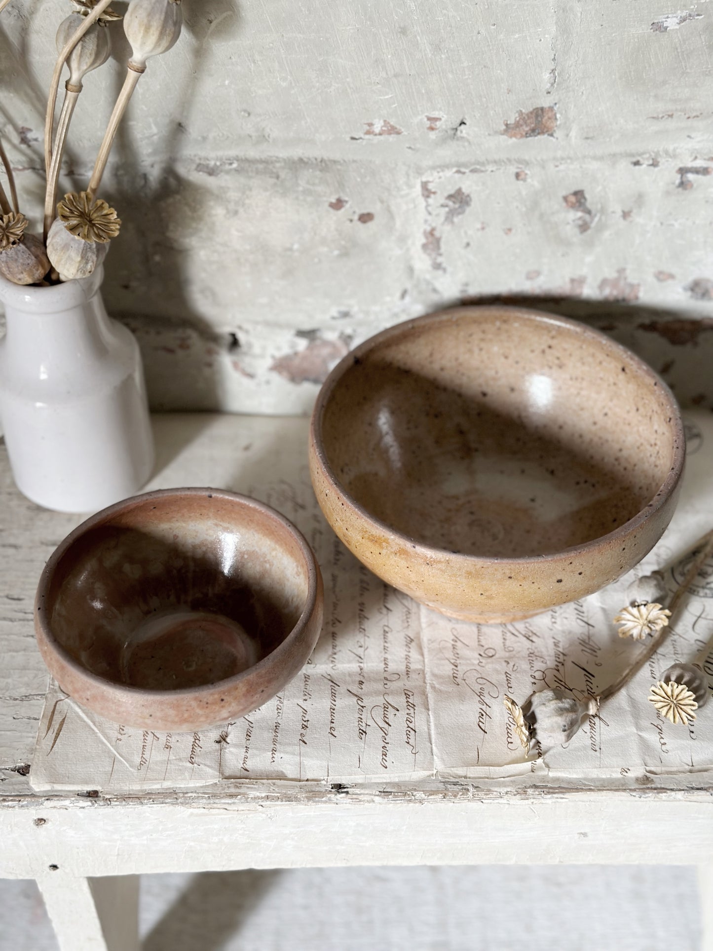 A pair of rustic antique French stoneware bowls