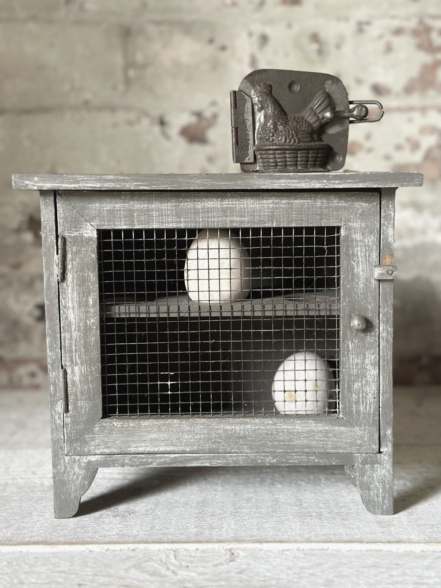 A vintage French chicken wire egg safe or egg cupboard egg holder egg rack