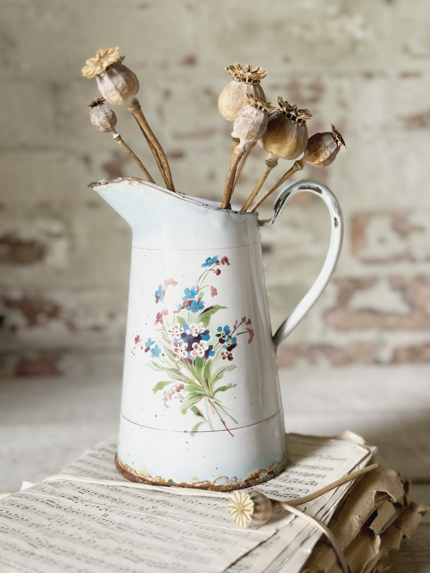A beautiful French antique enamel jug with floral detail