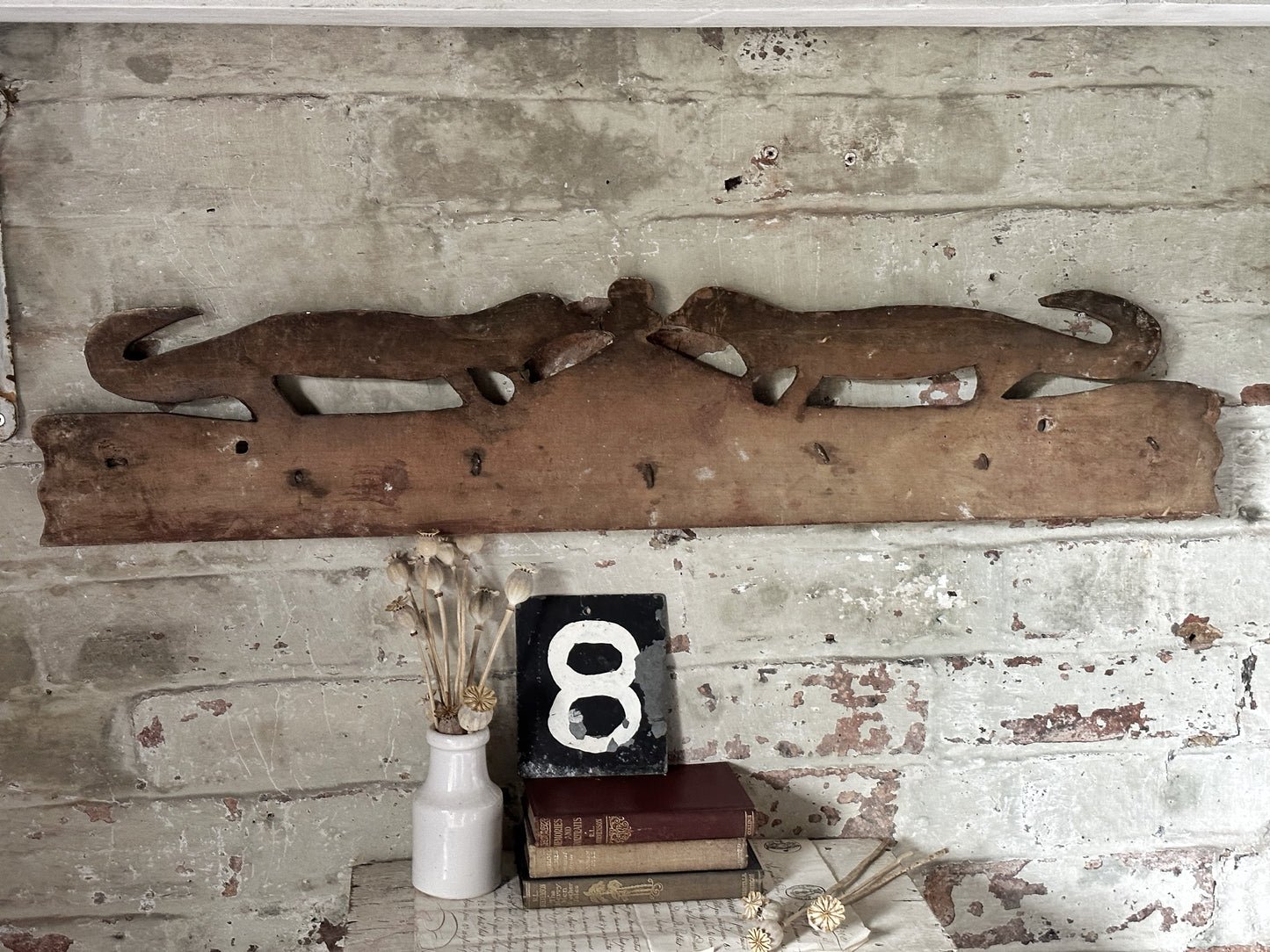 Antique primitive wooden game rack with stylised foxes