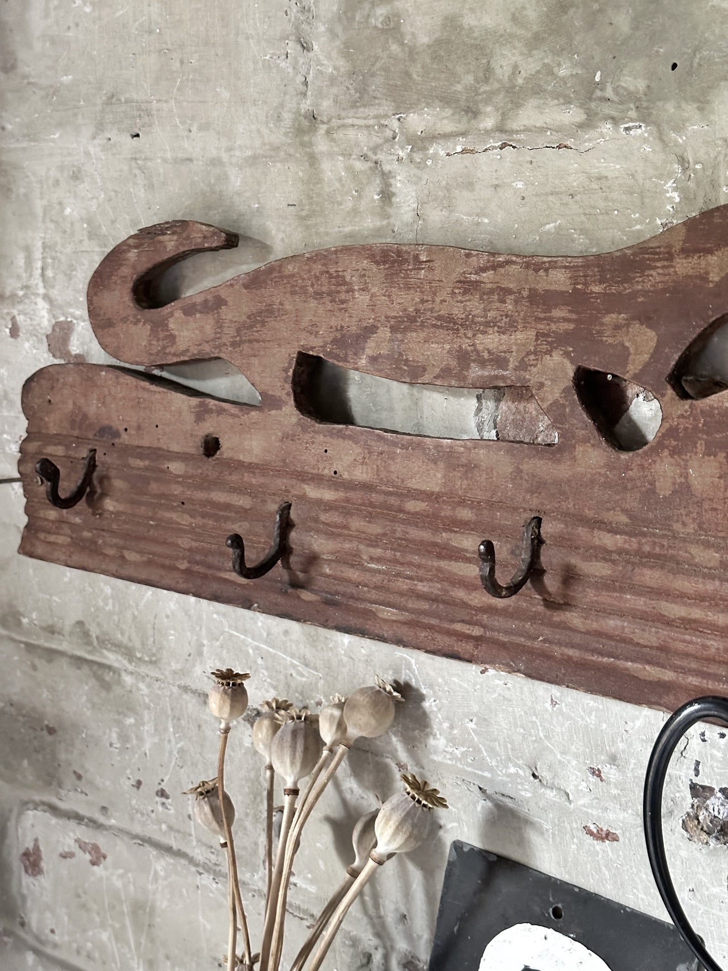 Antique primitive wooden game rack with stylised foxes