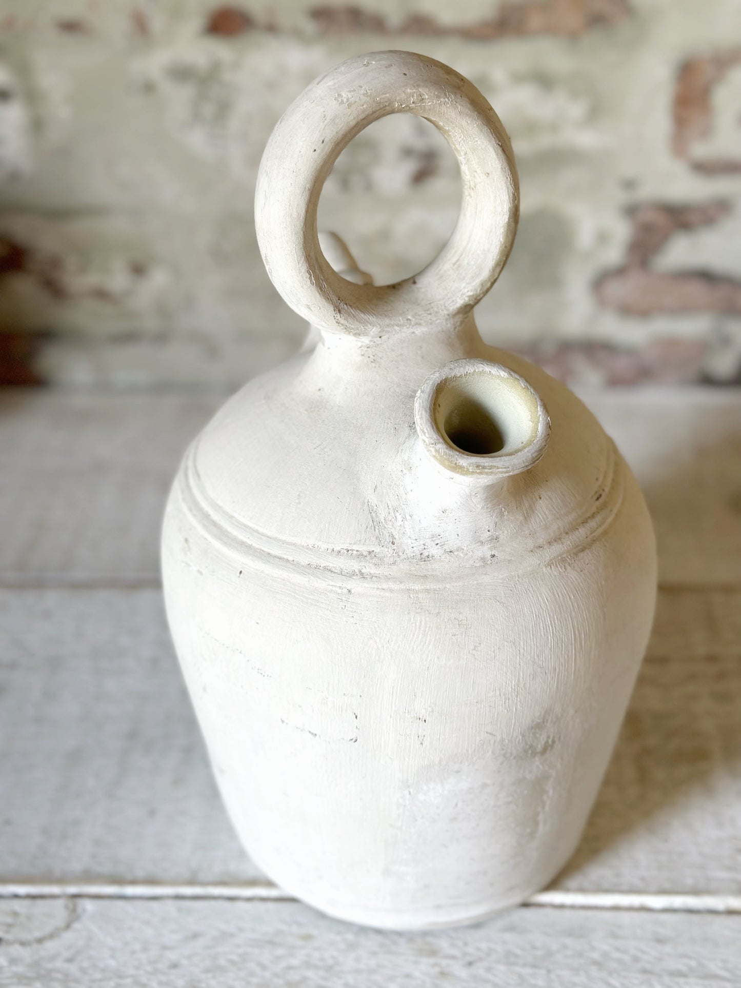 A vintage French stoneware gargoulette water bottle