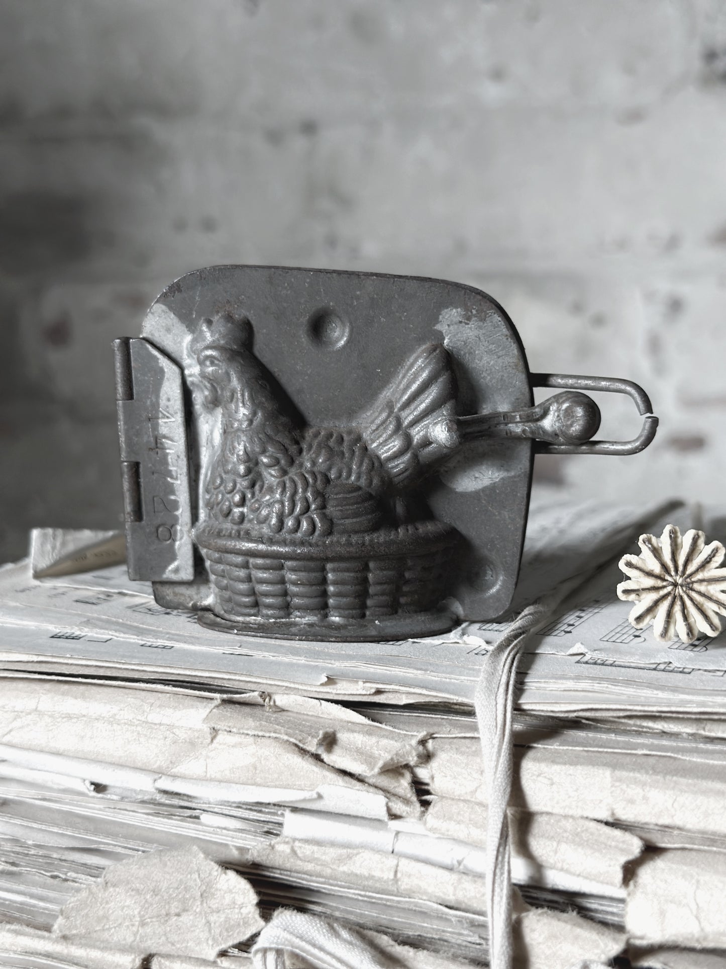 An Antique hinged chocolate mould hen