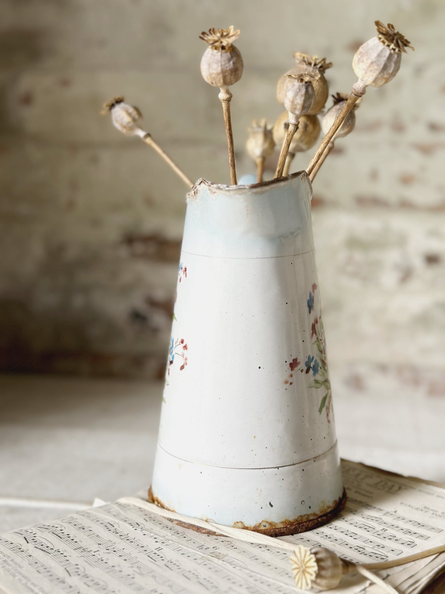 A beautiful French antique enamel jug with floral detail