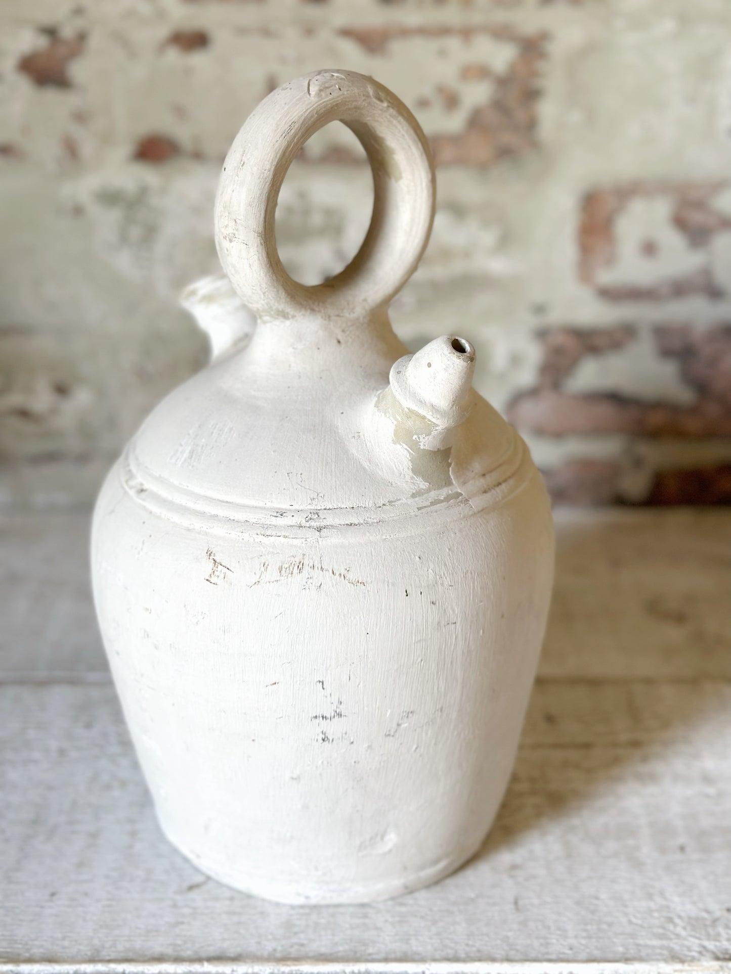 A vintage French stoneware gargoulette water bottle