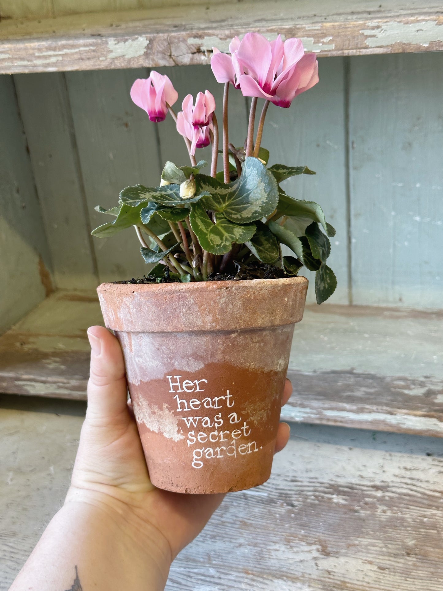 A Victorian terracotta pot with a quote