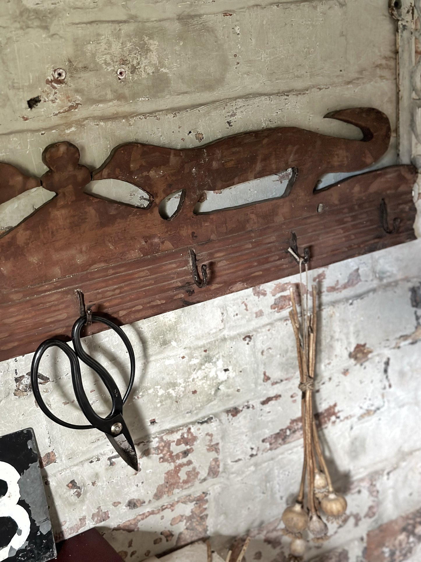 Antique primitive wooden game rack with stylised foxes