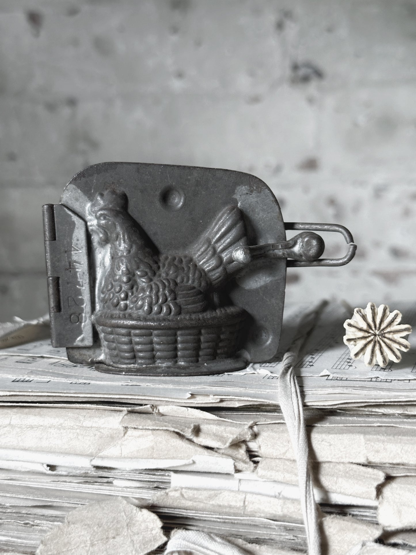 An Antique hinged chocolate mould hen
