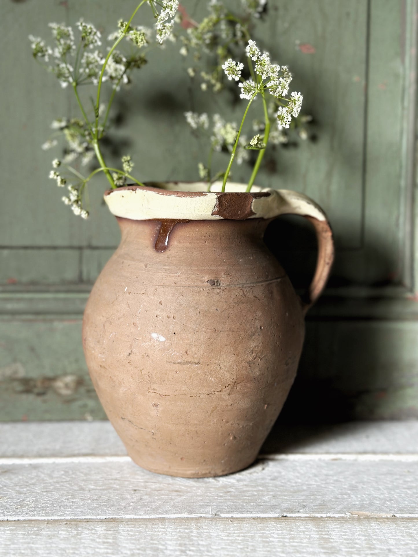 Antique pottery glazed dairy jug