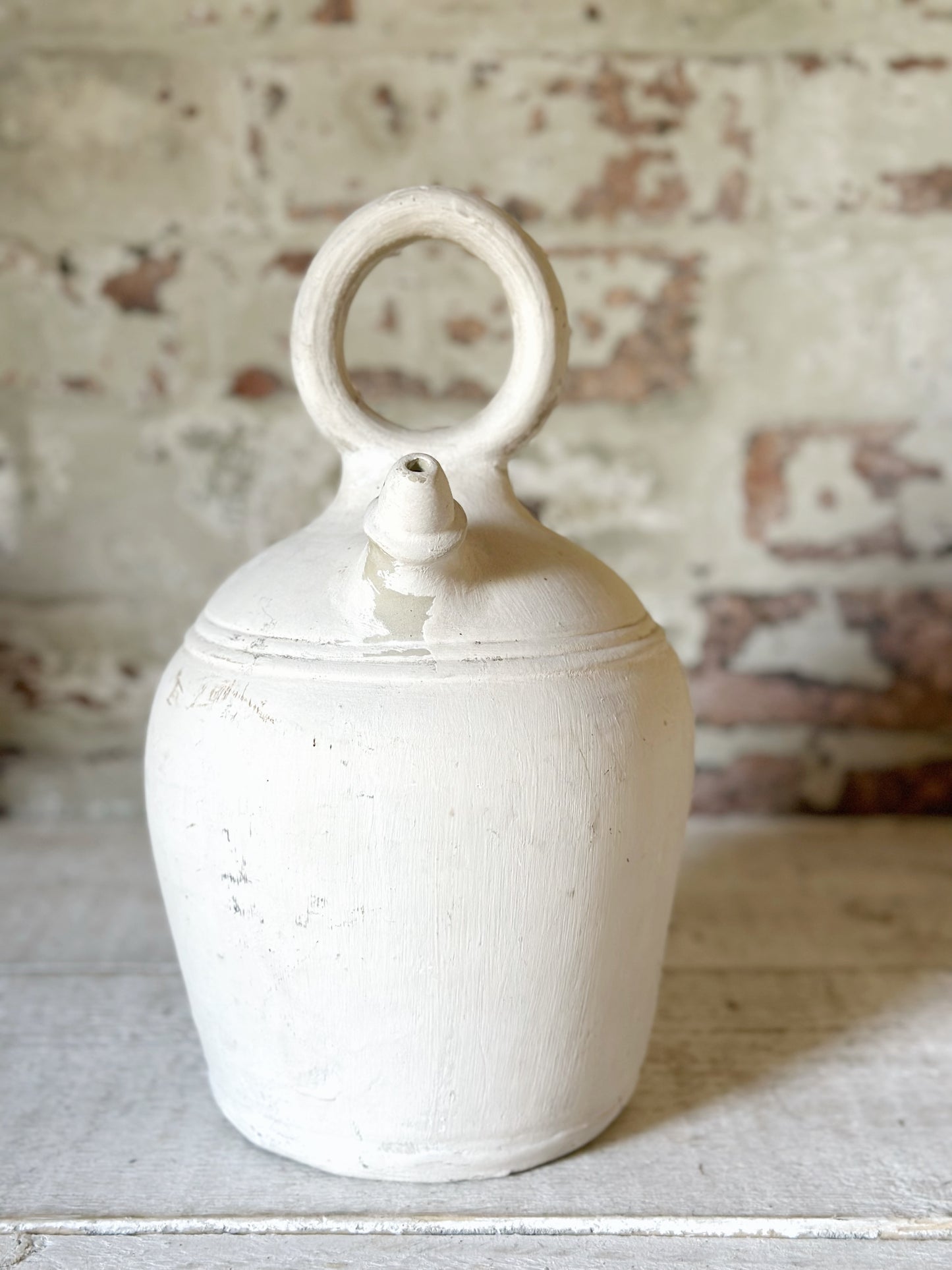 A vintage French stoneware gargoulette water bottle