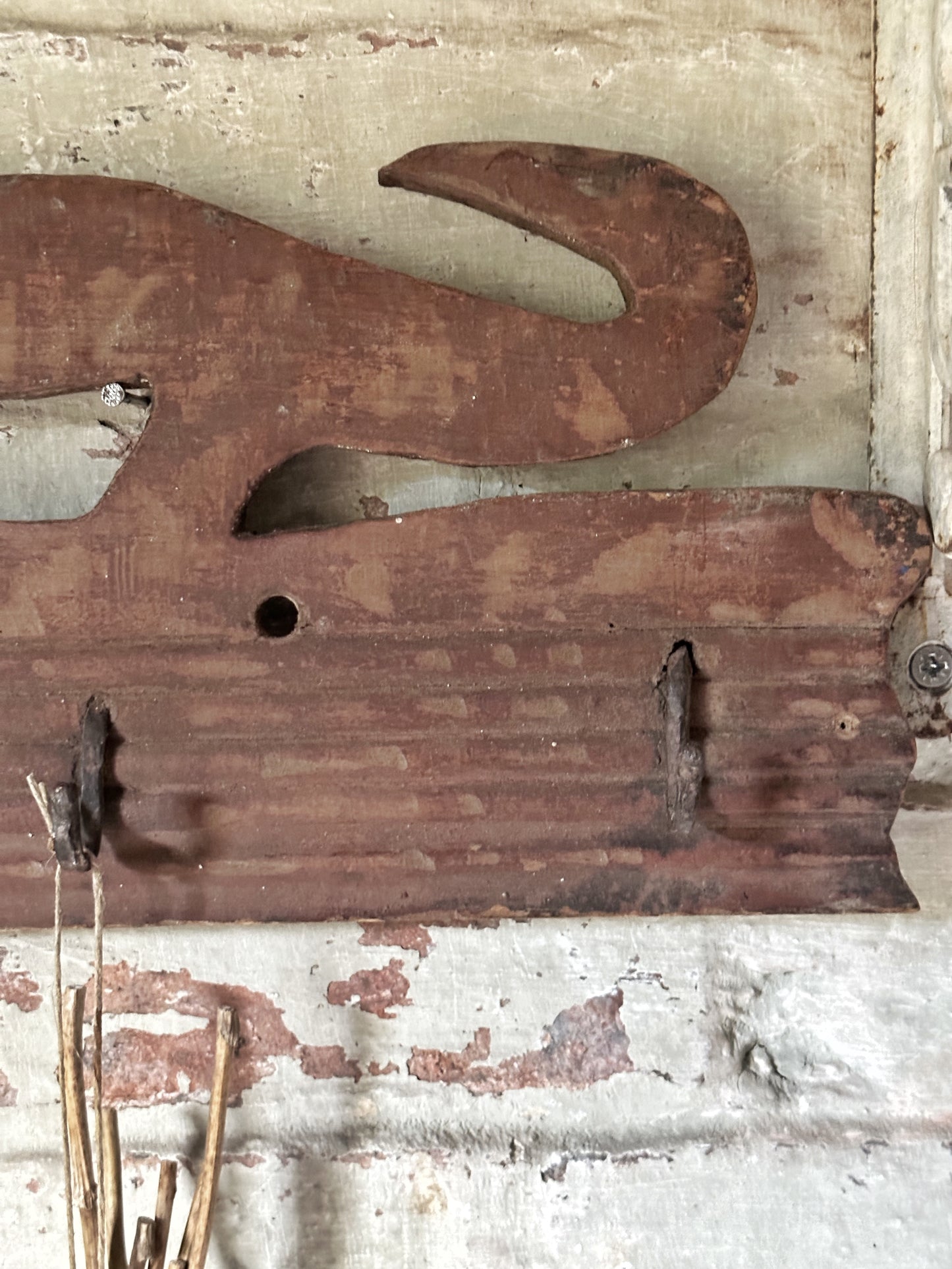 Antique primitive wooden game rack with stylised foxes