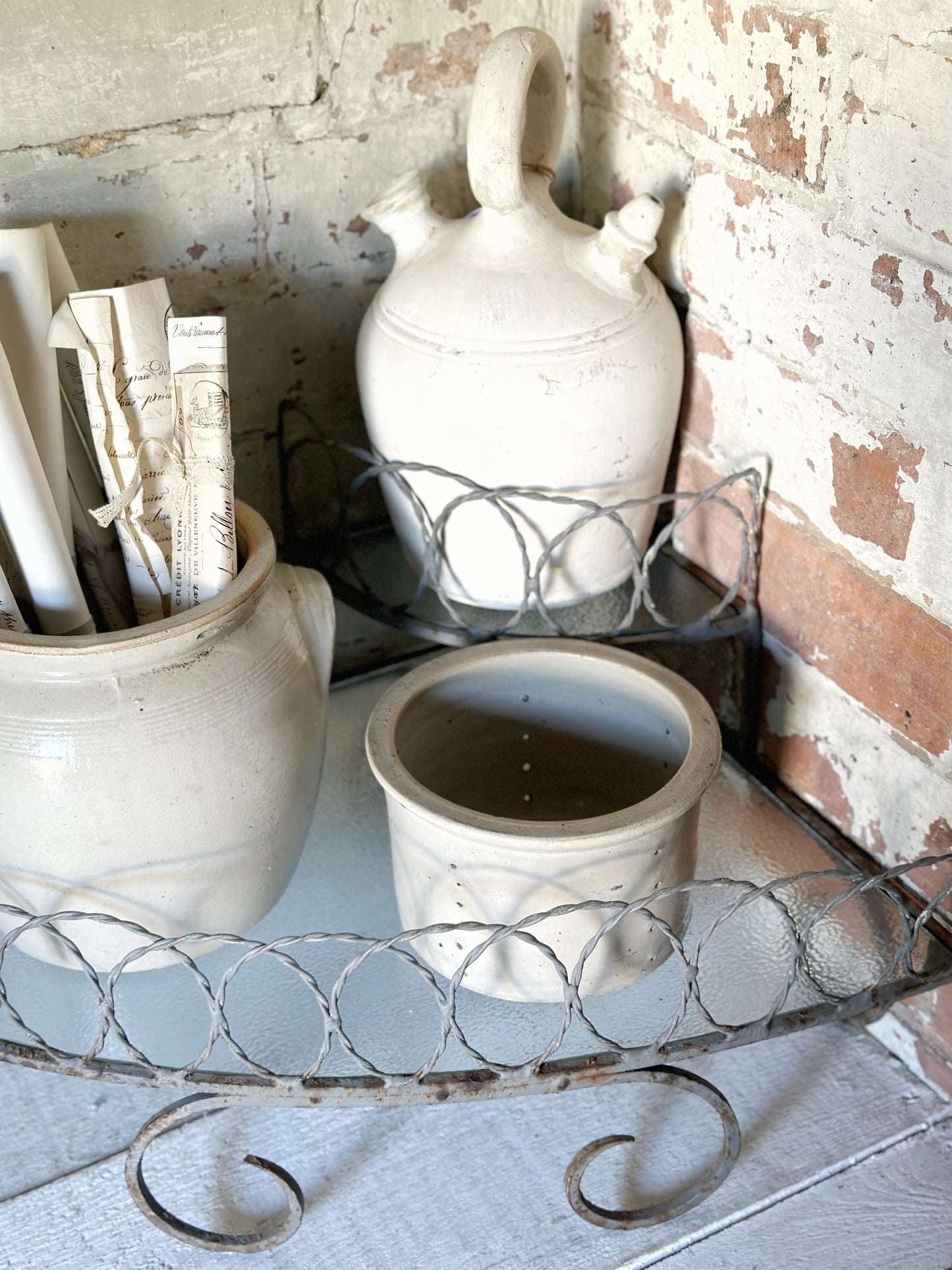 A vintage French stoneware gargoulette water bottle