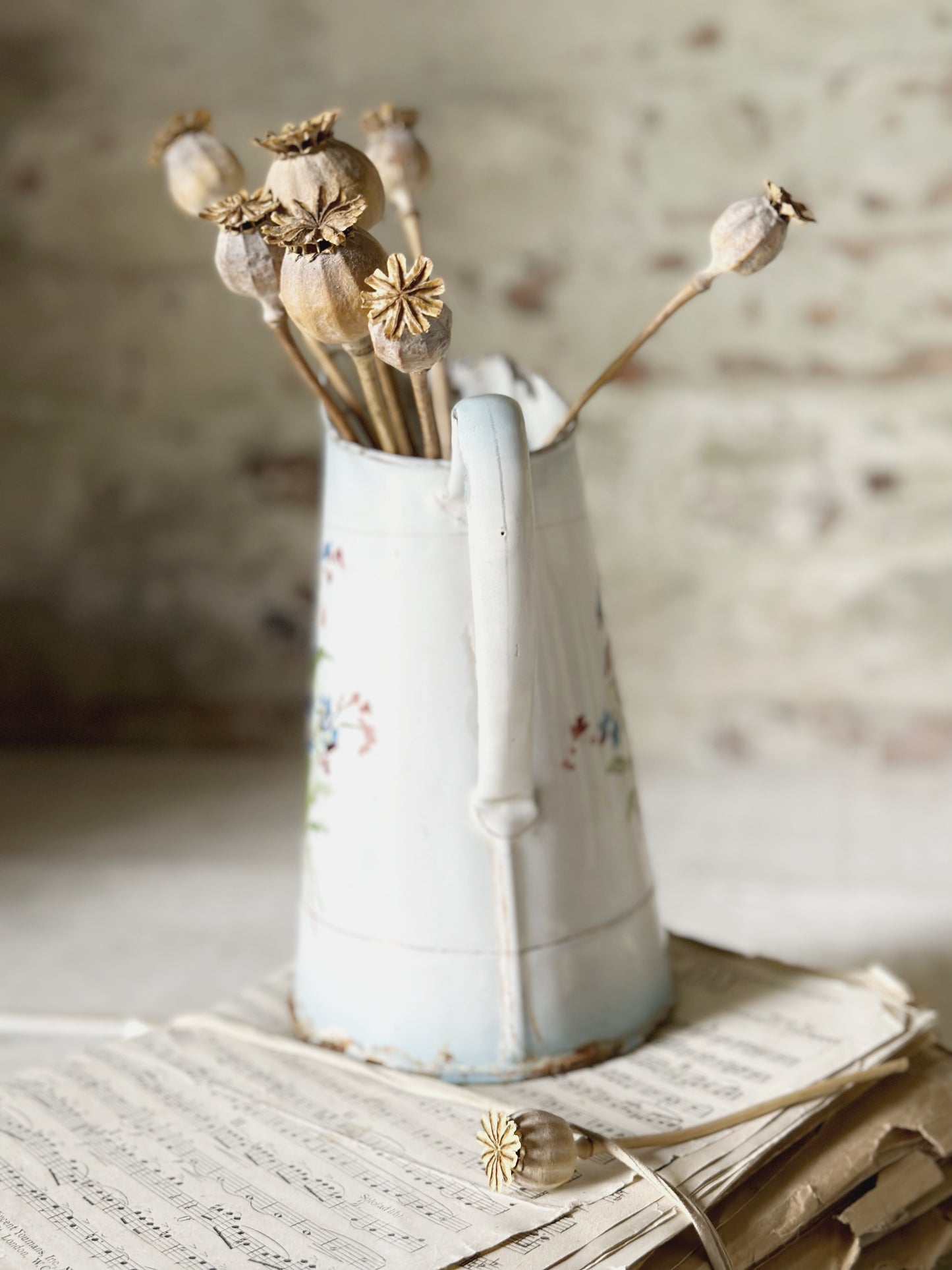 A beautiful French antique enamel jug with floral detail
