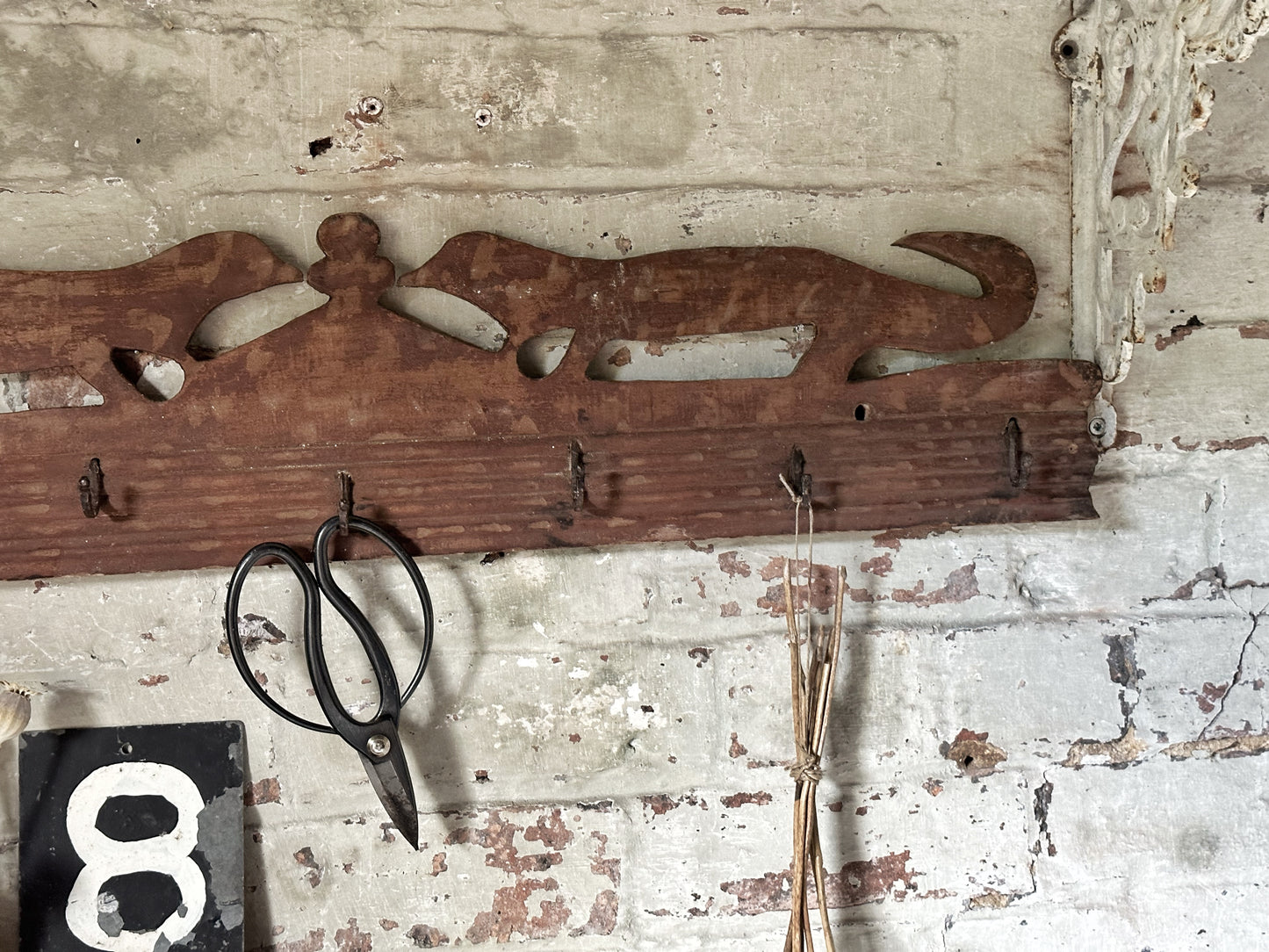 Antique primitive wooden game rack with stylised foxes