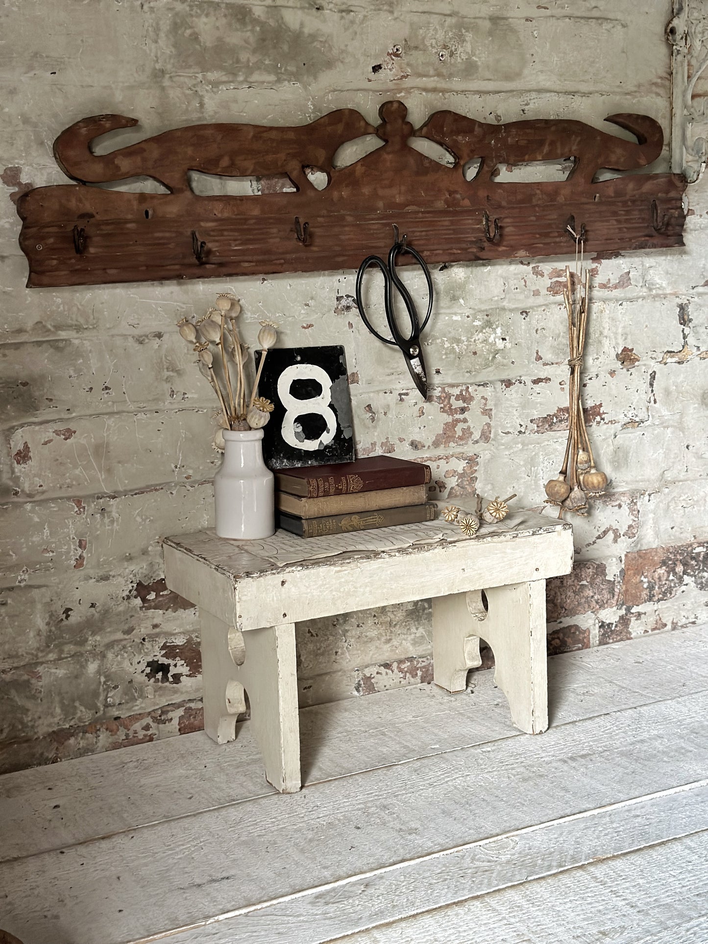 Antique primitive wooden game rack with stylised foxes