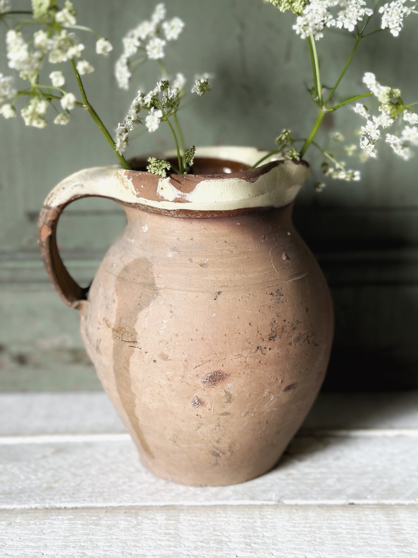 Antique pottery glazed dairy jug