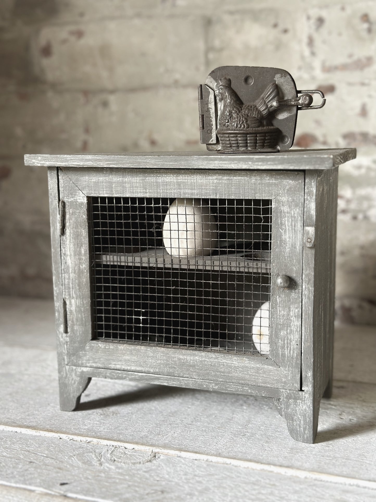 A vintage French chicken wire egg safe or egg cupboard egg holder egg rack