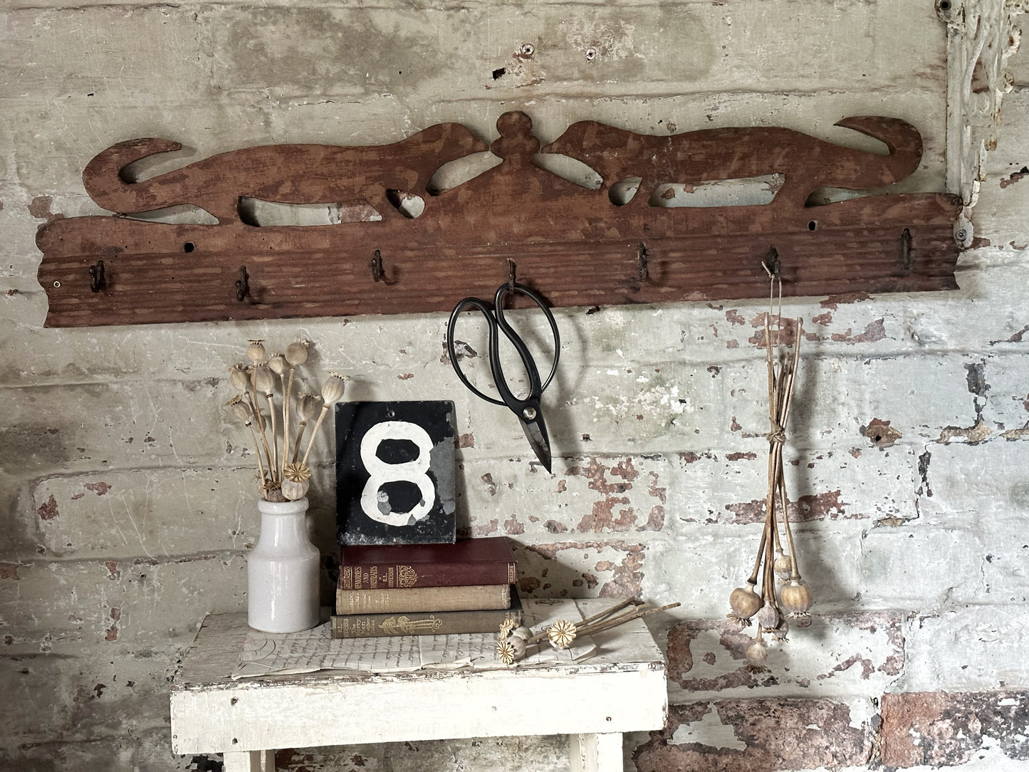 Antique primitive wooden game rack with stylised foxes
