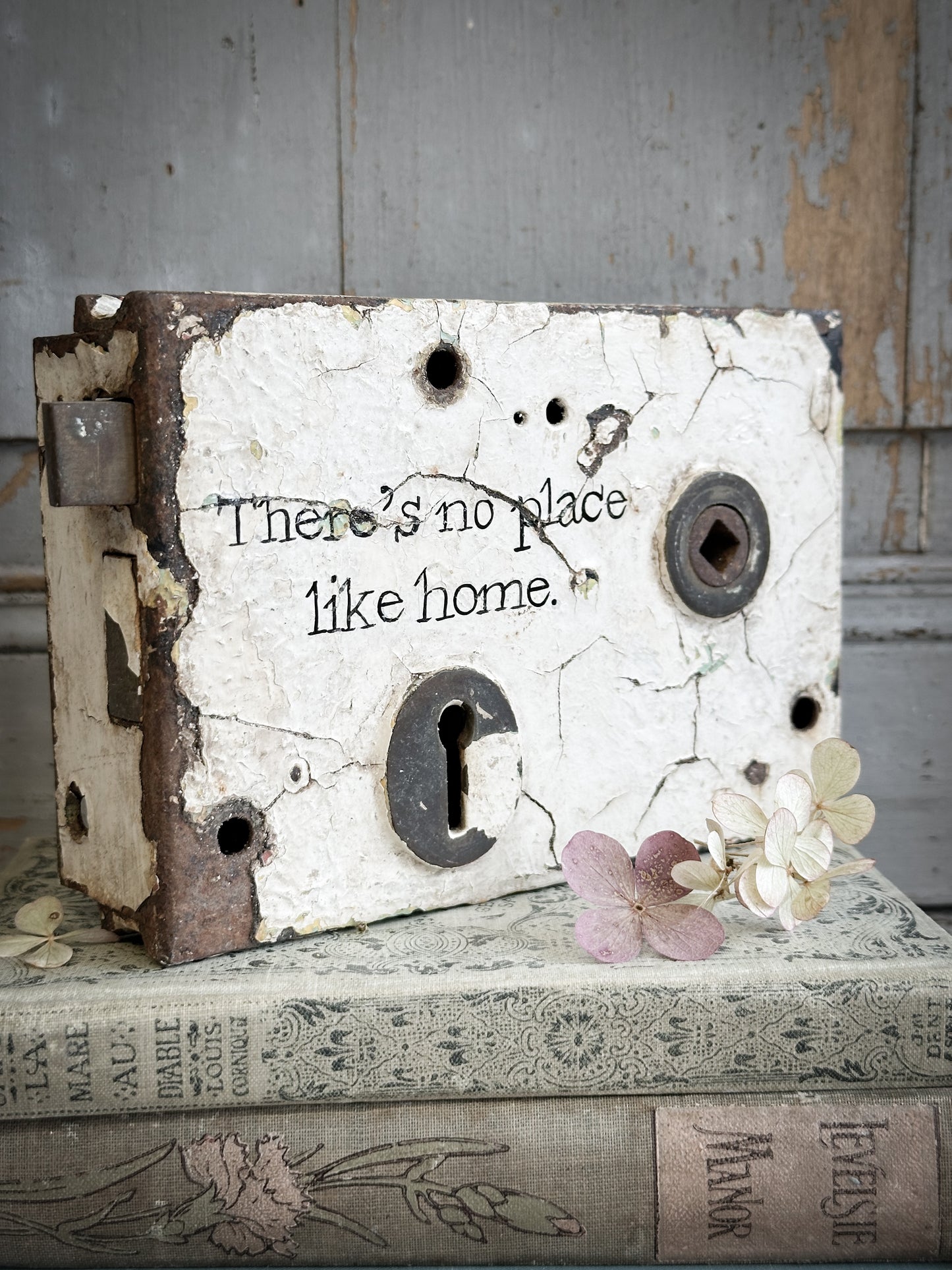 An Antique Lock With Hand Painted Quote