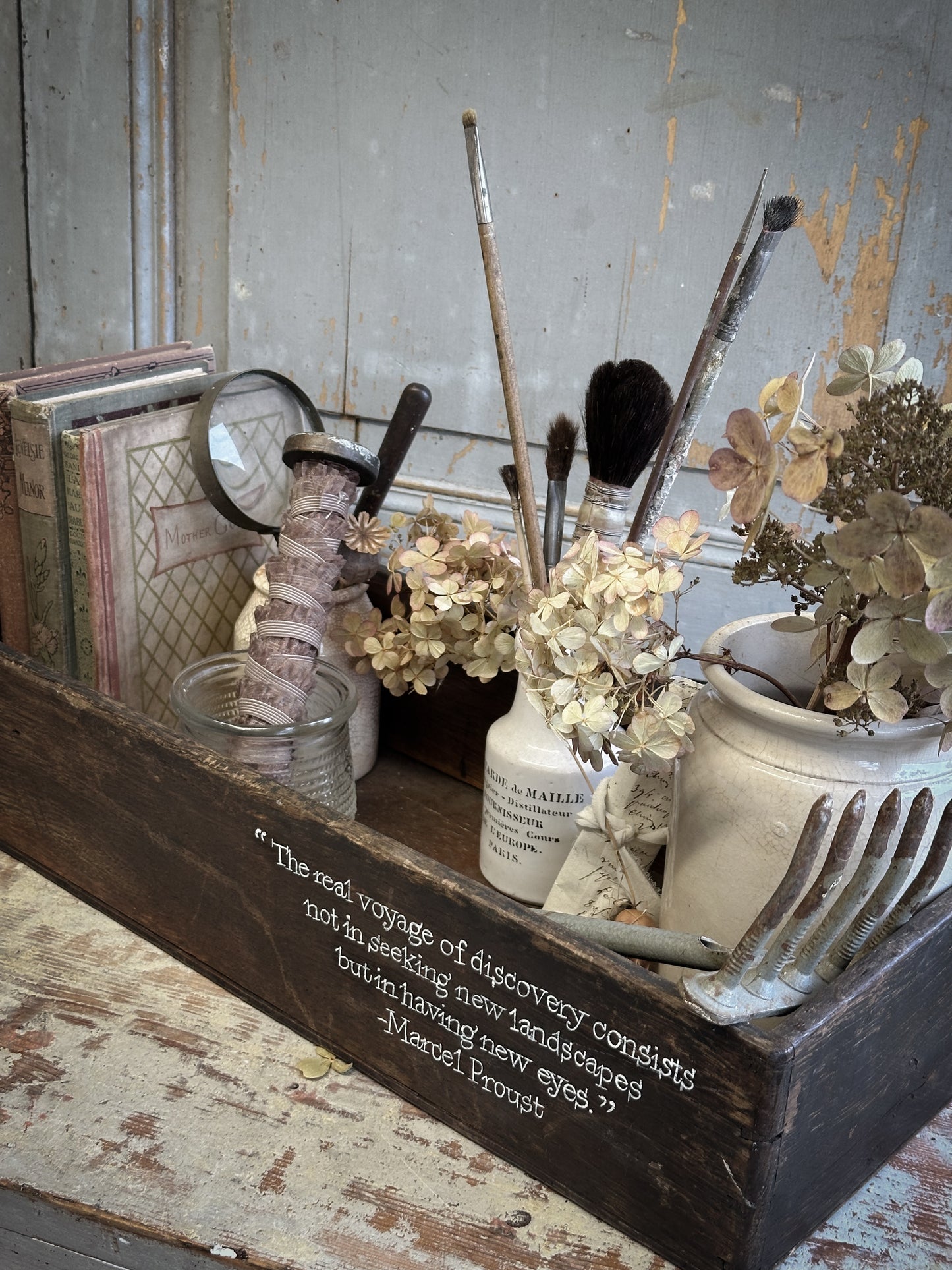 A Vintage Wooden Crate With Hand Painted Quote