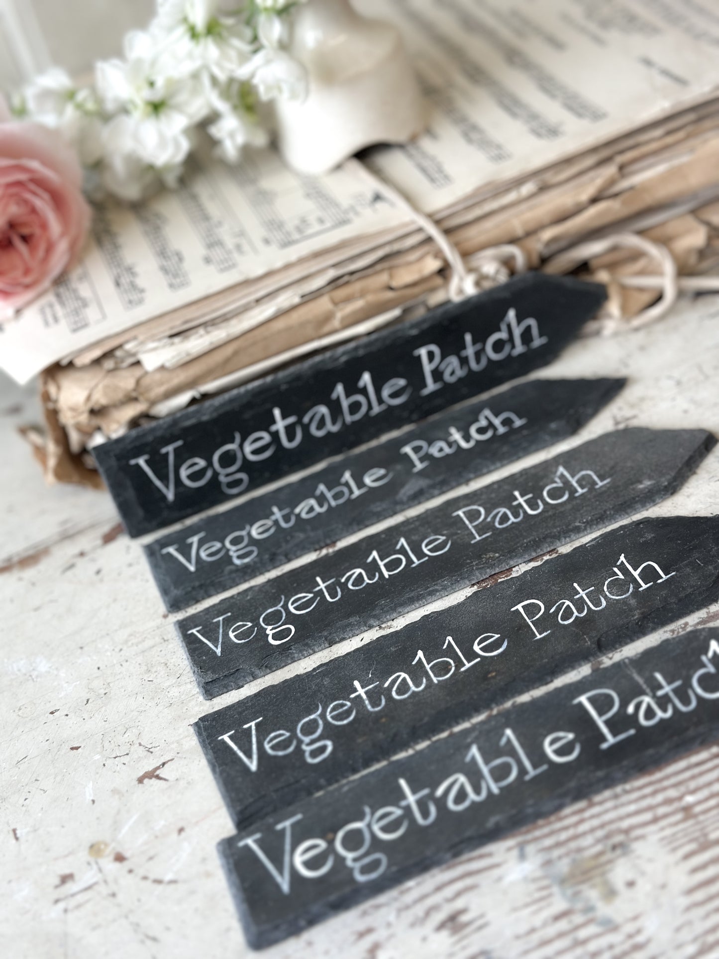 A small hand painted Victorian Welsh slate sign in lower case “Vegetable Patch”