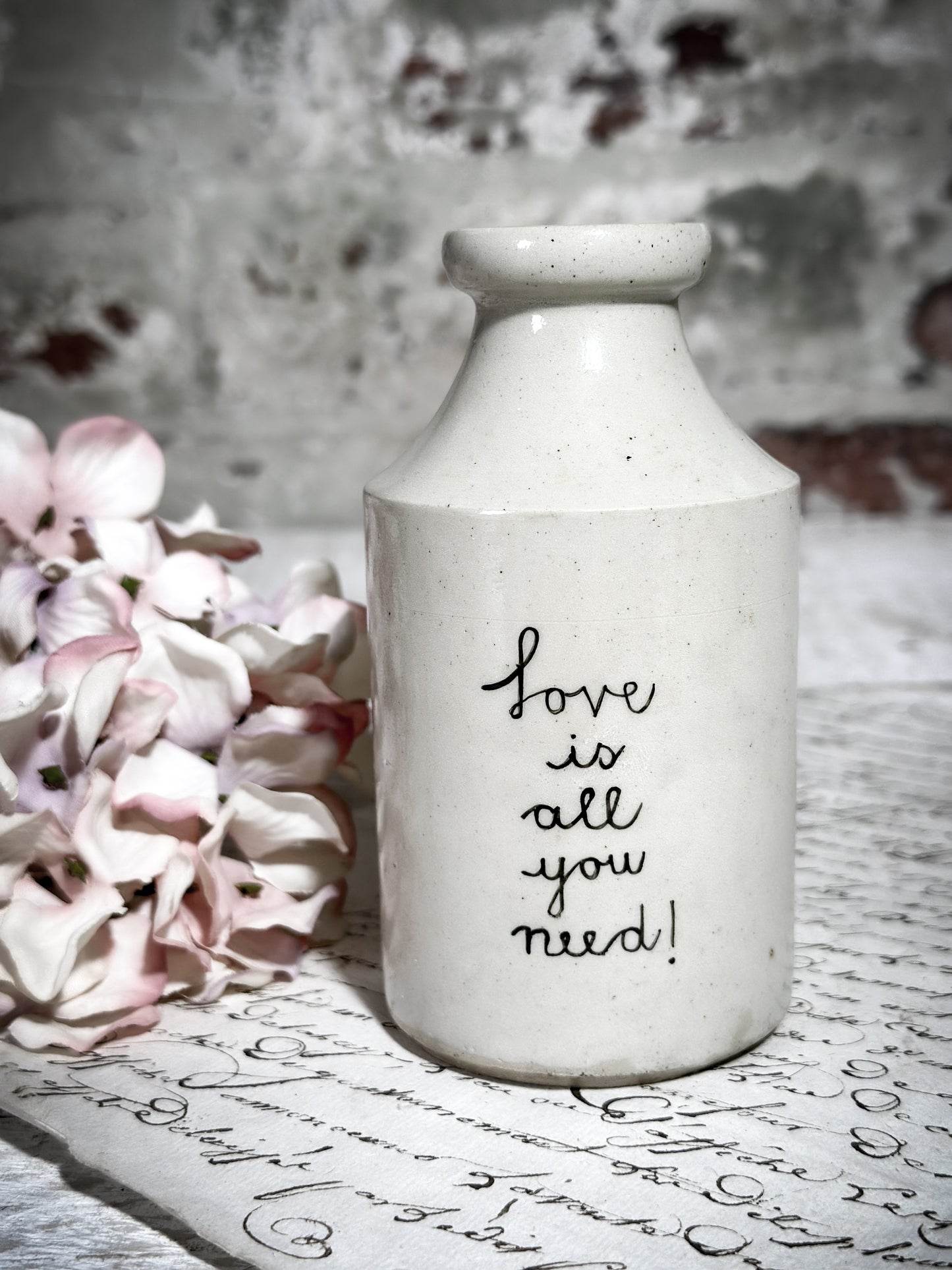 An Antique Bottle with a Hand Painted Inspirational Quote