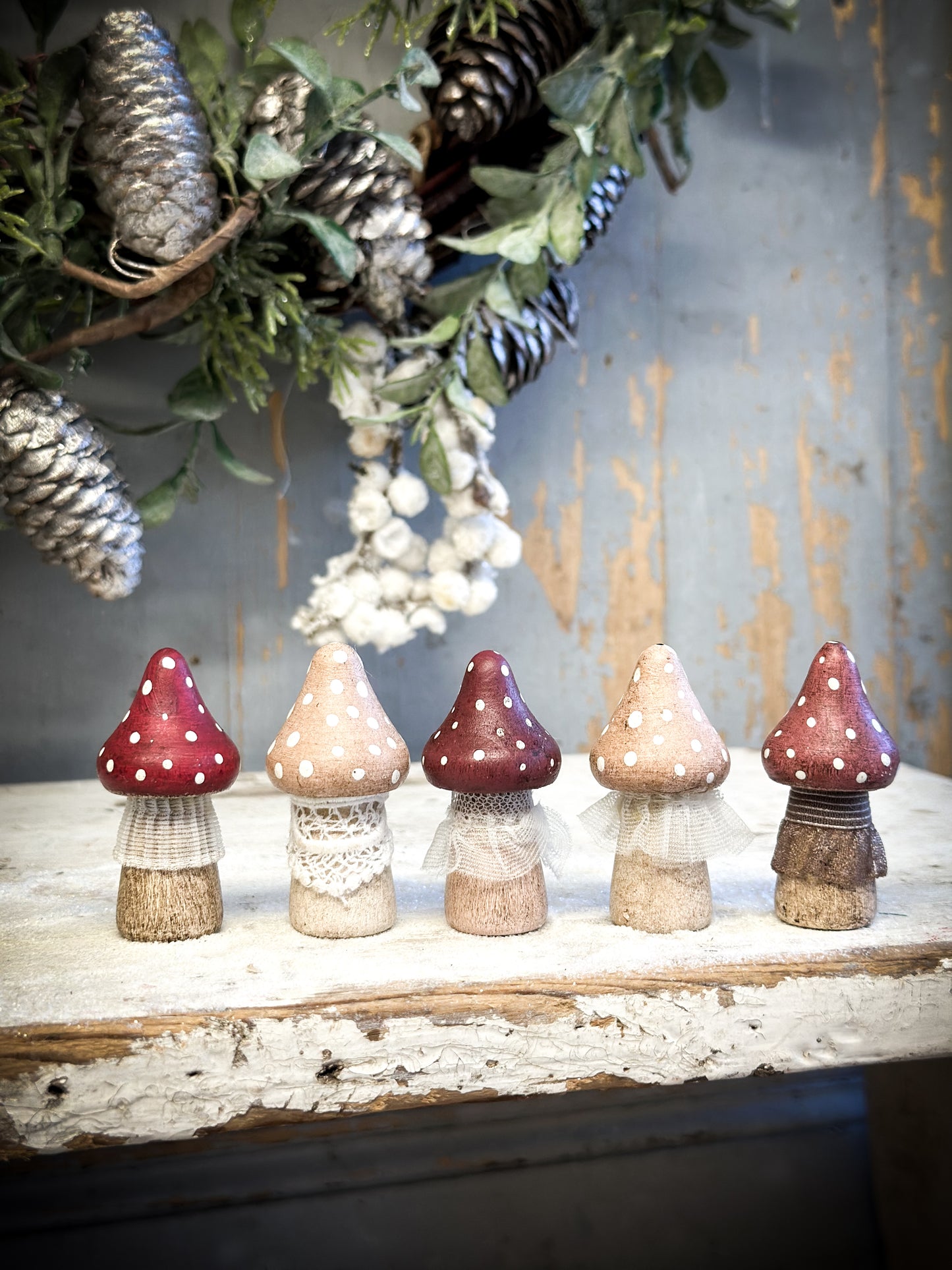 A wooden hand painted and trimmed Christmas village toadstool medium pointy one